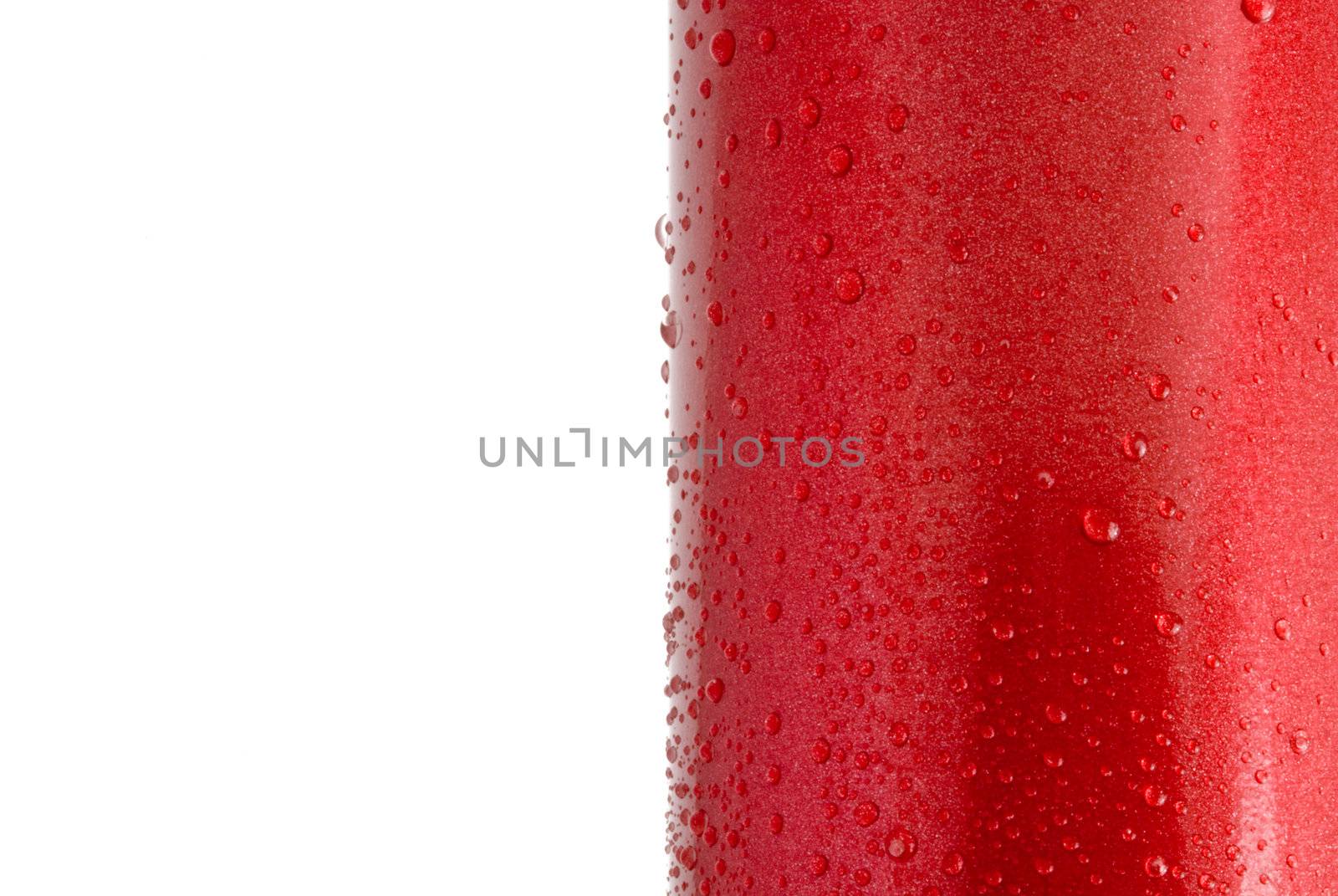 Water droplets on a red shiny metal surface, closeup