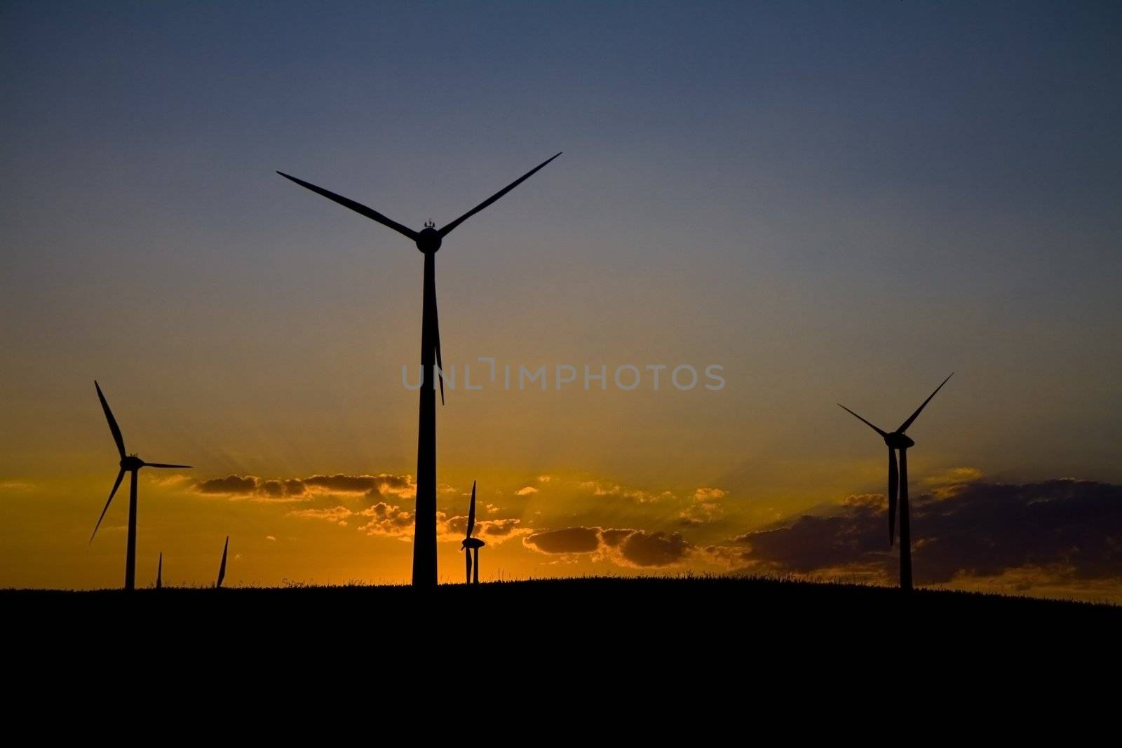 Windmills at sunset by Gbuglok