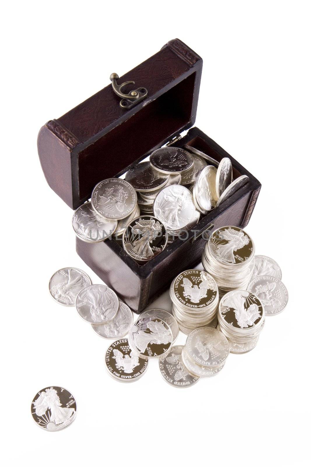 Old case full of silver coins, isolated on white background