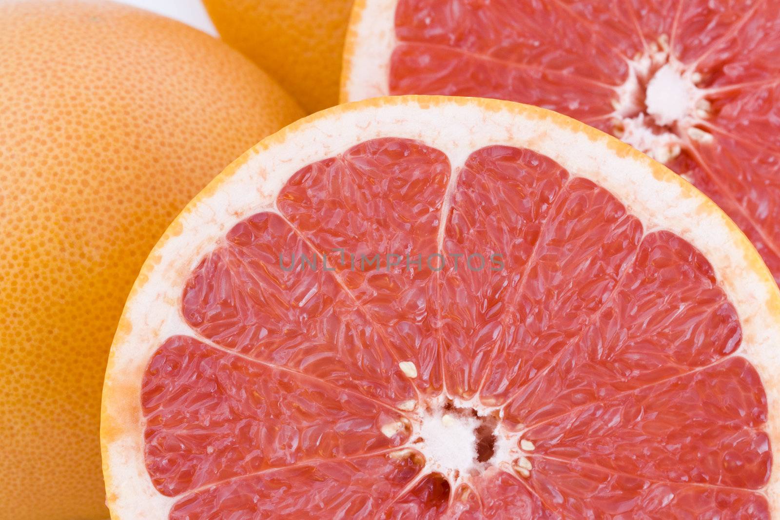 Red grapefruits background by Gbuglok
