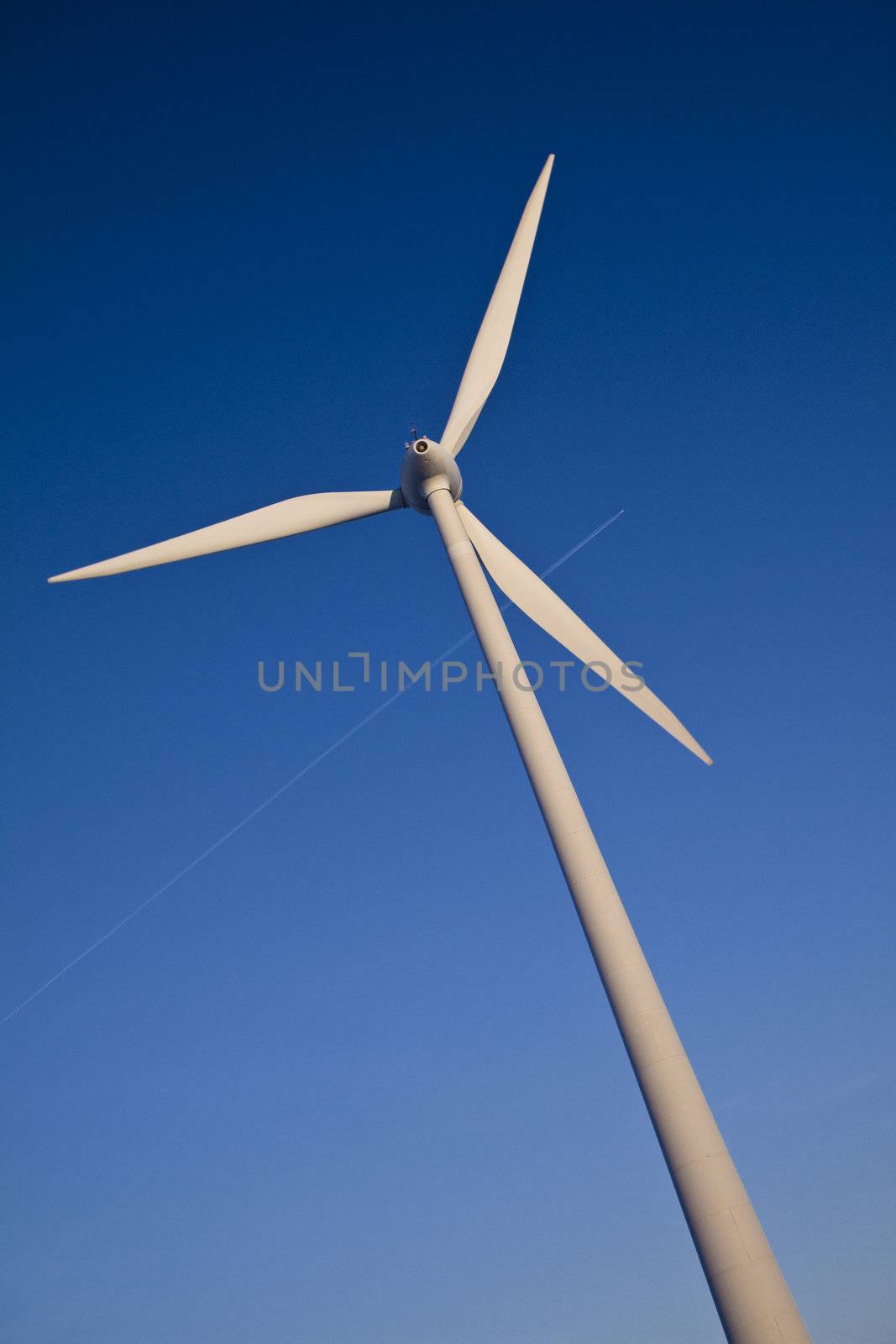 Windmill with plane trail by Gbuglok