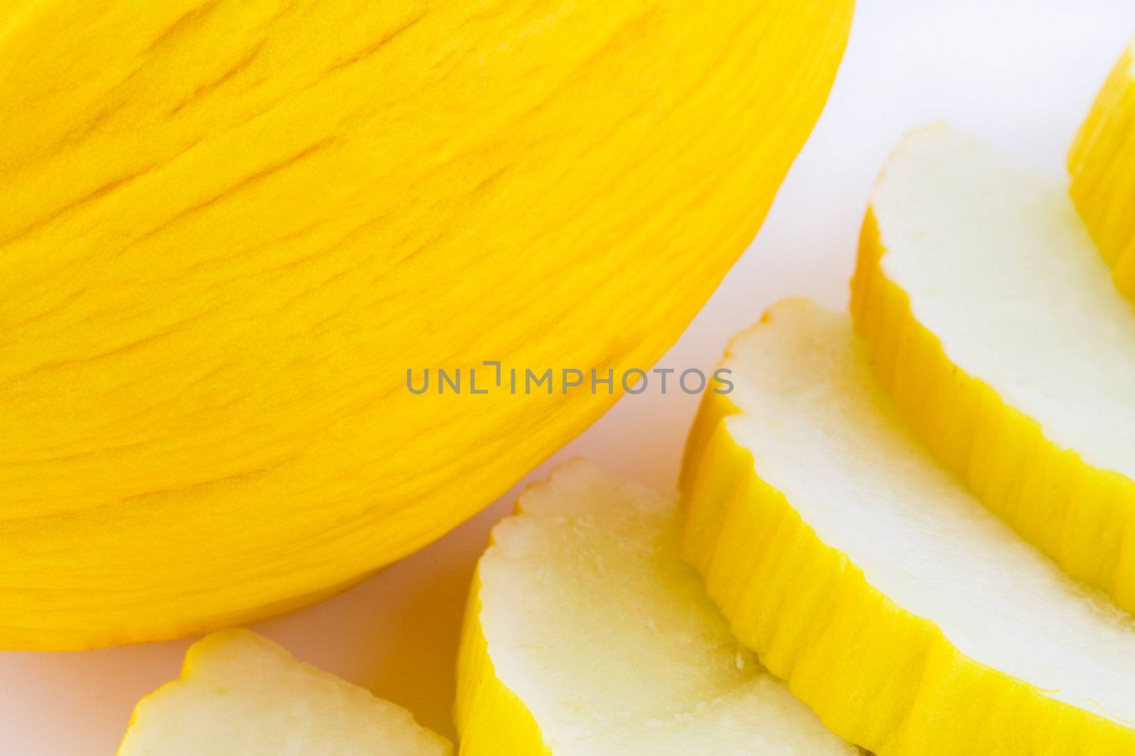Yellow melon slices on white background, sweet fruit