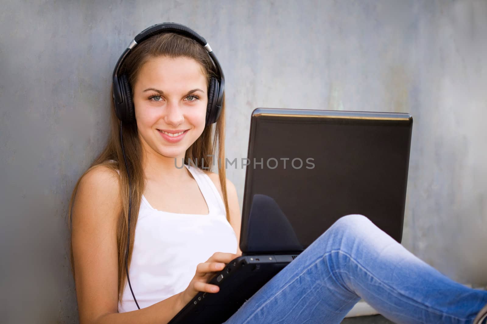 Young girl with headphones and notebook by Gbuglok