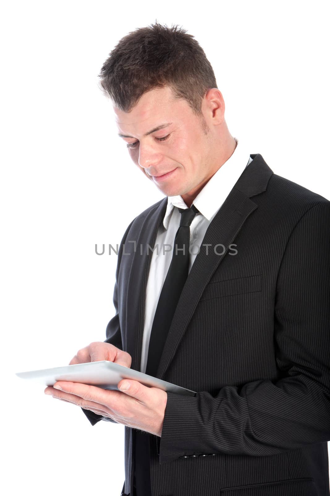 Positive businessman using a tablet isolated on white