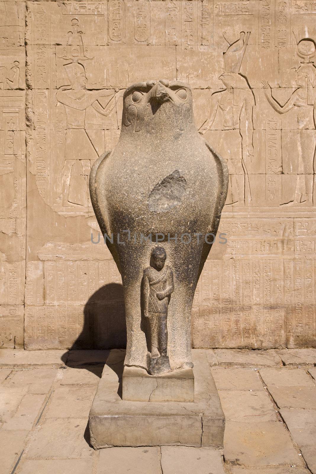 Ancient stone statue in Egyptian temple, incarnation of Pharaoh