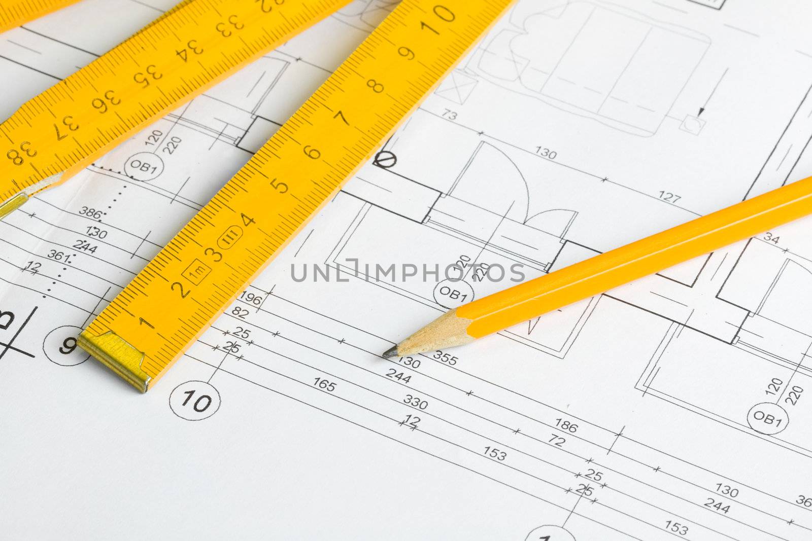 Architectural drawing, pencil and yellow wooden measurement tape