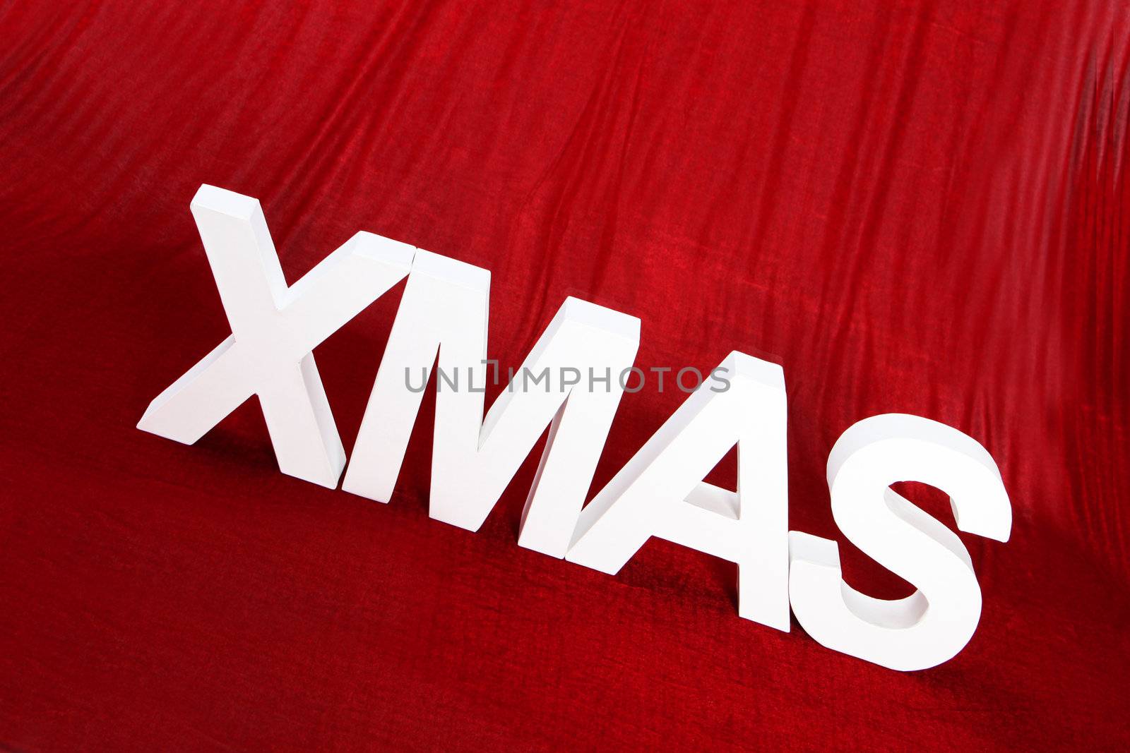 White Xmas letters on a wooden surface