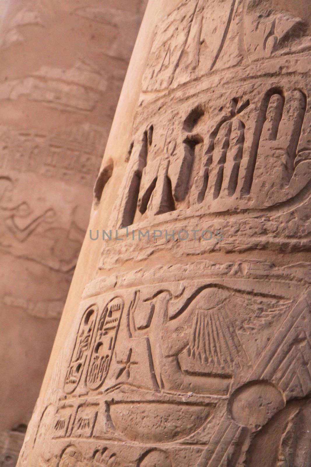 Ancient hieroglyphics on stone column by Gbuglok