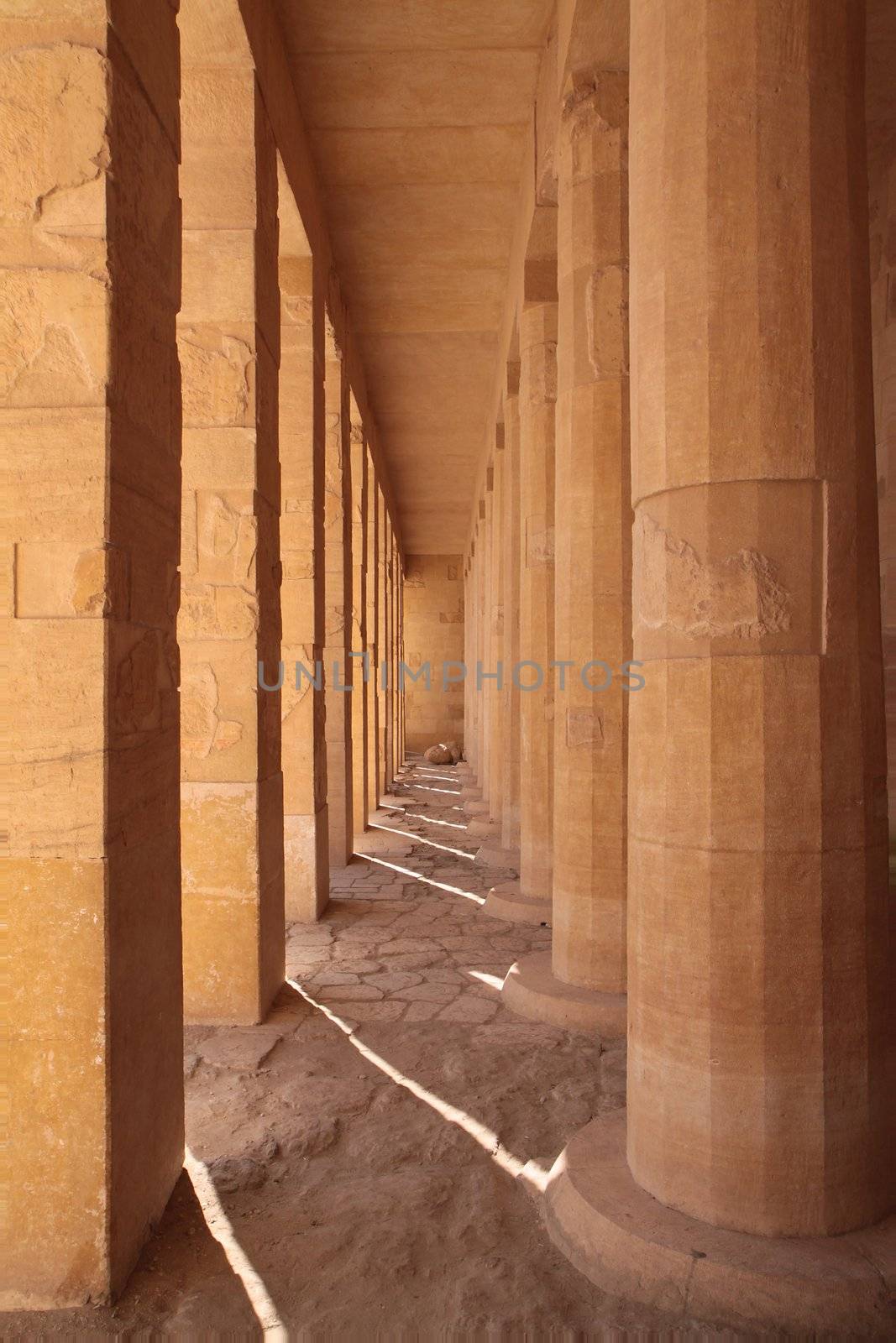 Ancient stone square and round columns in Egyptian temple