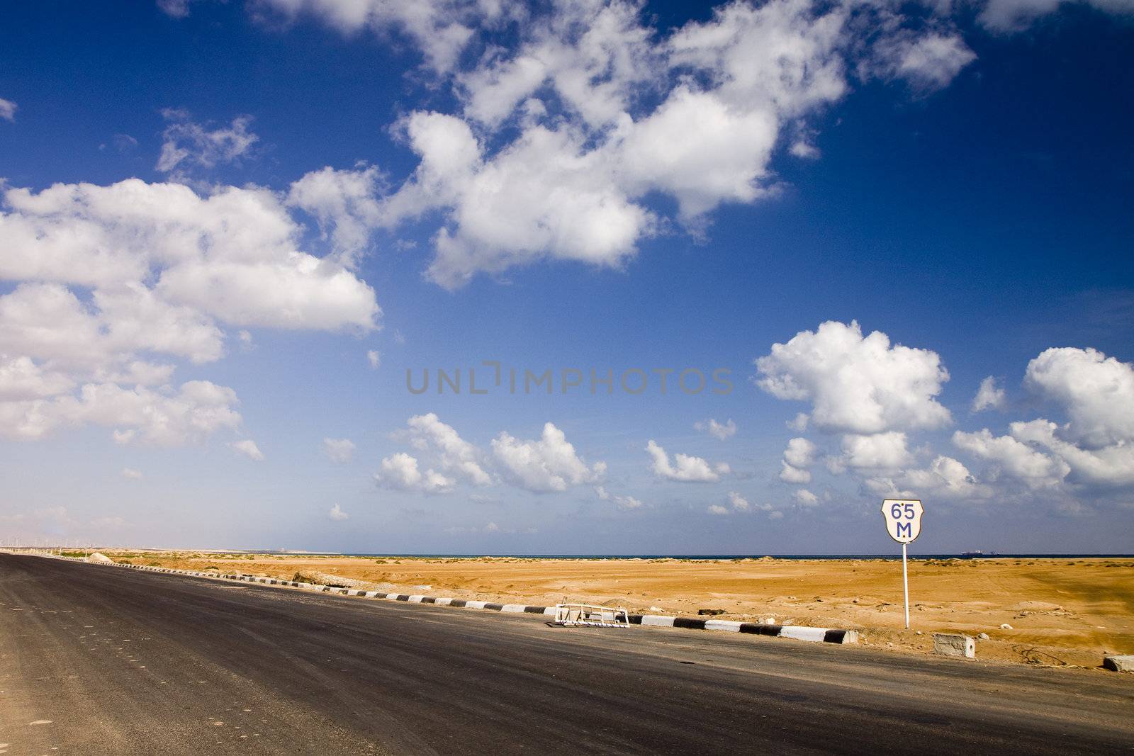The road in the desert near sea