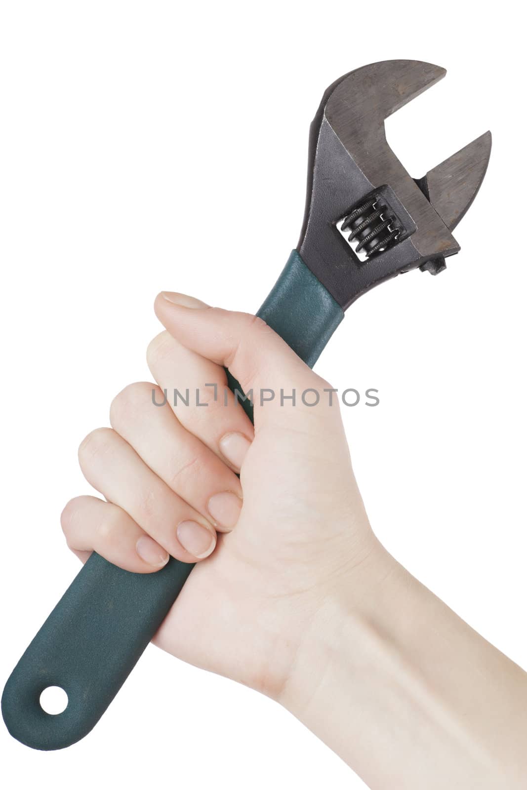 Adjustable wrench in woman's hand isolated over white background