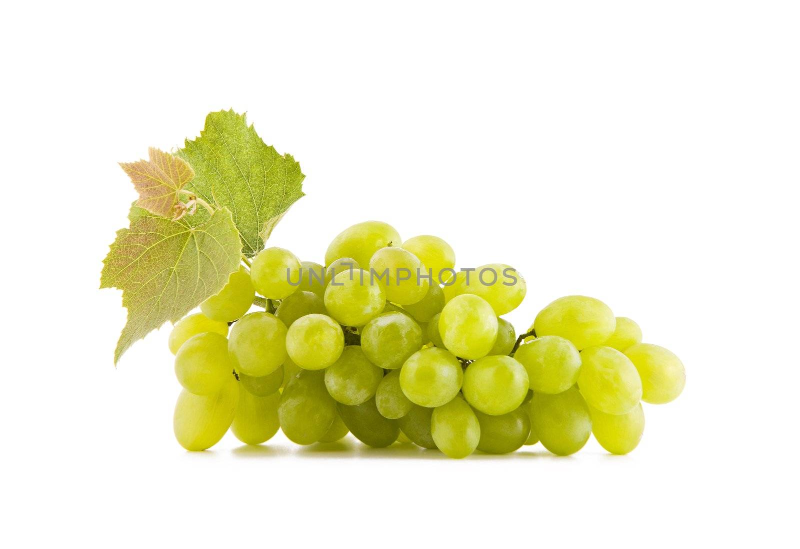 Fresh grape fruits with green leaves isolated on white