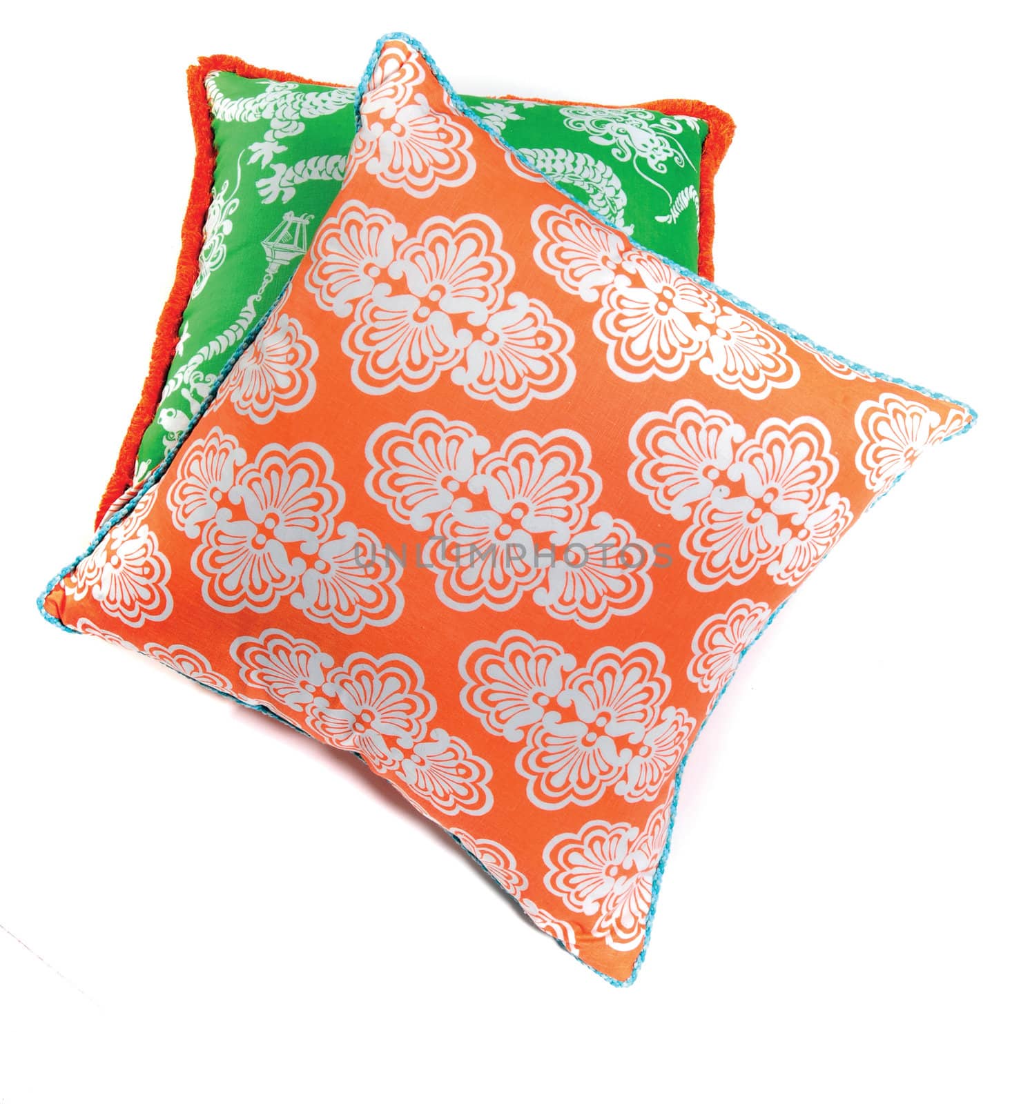 decorative orange and green pillows isolated on white background
