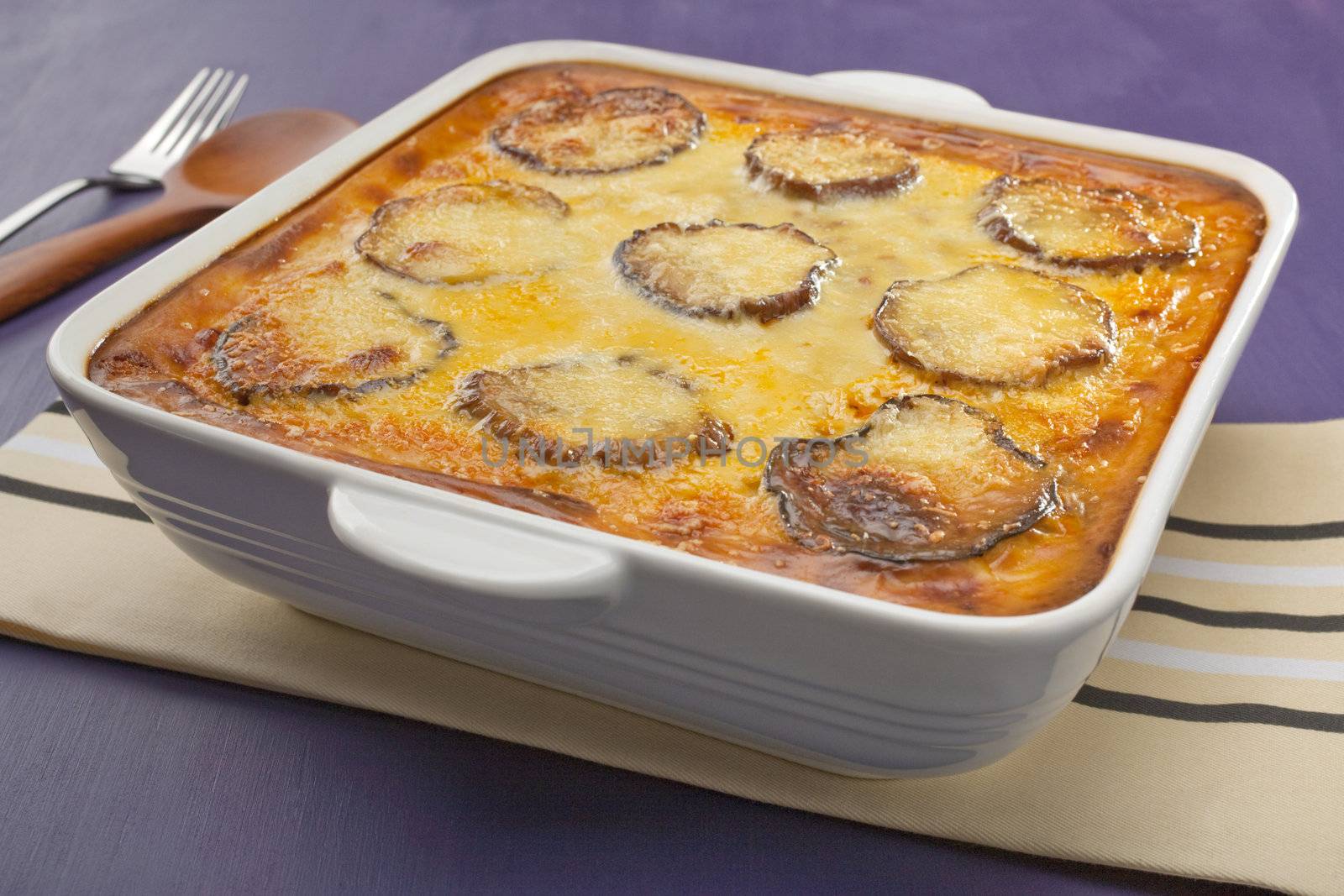 Favourite Greek dish, Moussaka, layers of eggplant and lamb topped with bechamel sauce and cheese.