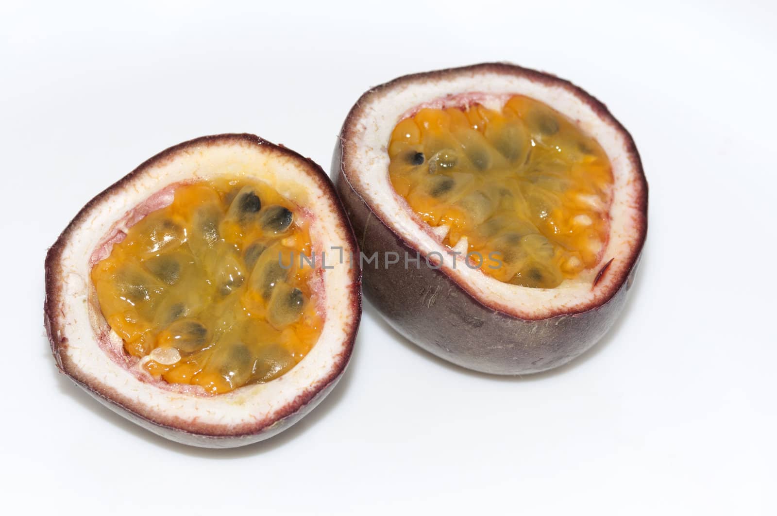 cut passion fruit on white background