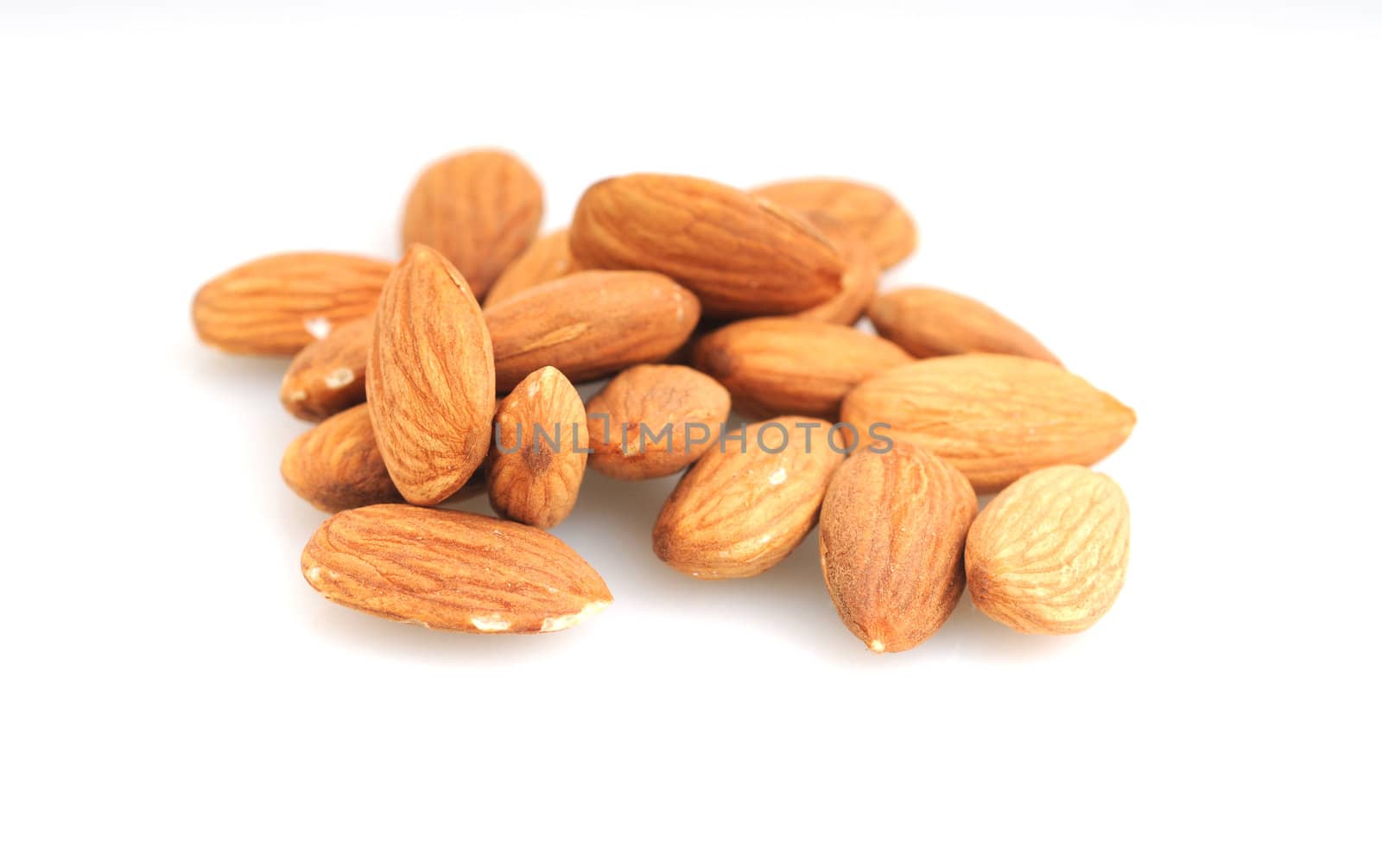 Raw almonds on a white background