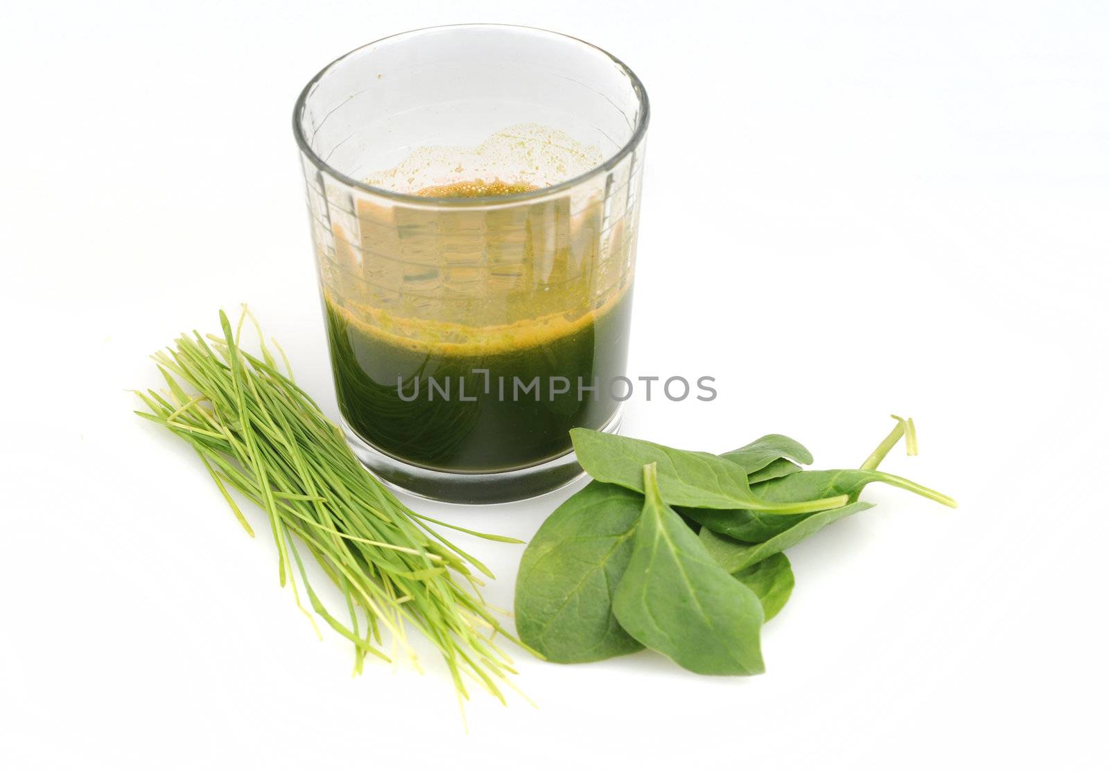 A healthy green juice or drink made with spinach and wheat grass