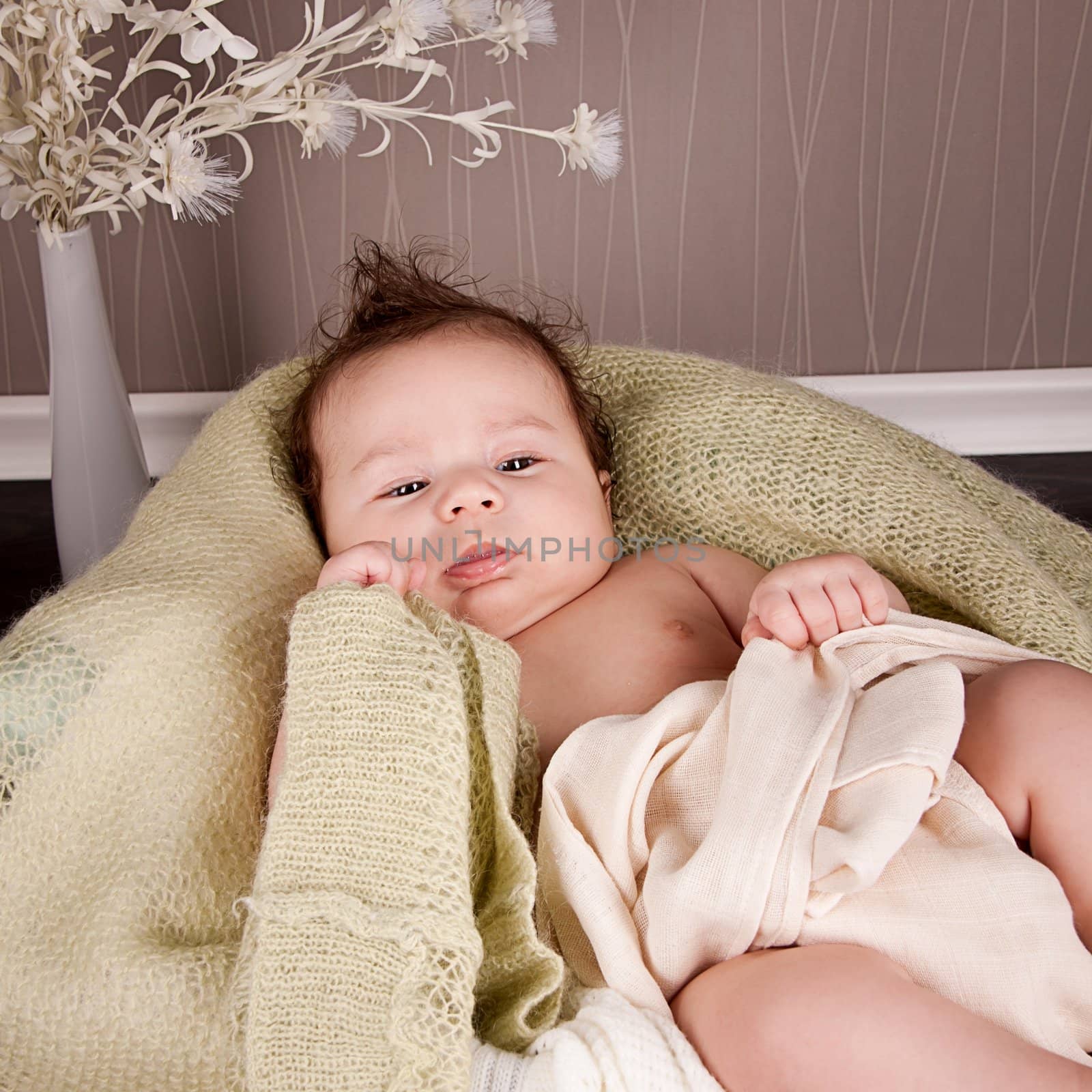 sweet little baby infant toddler on white  blanket in basket at home