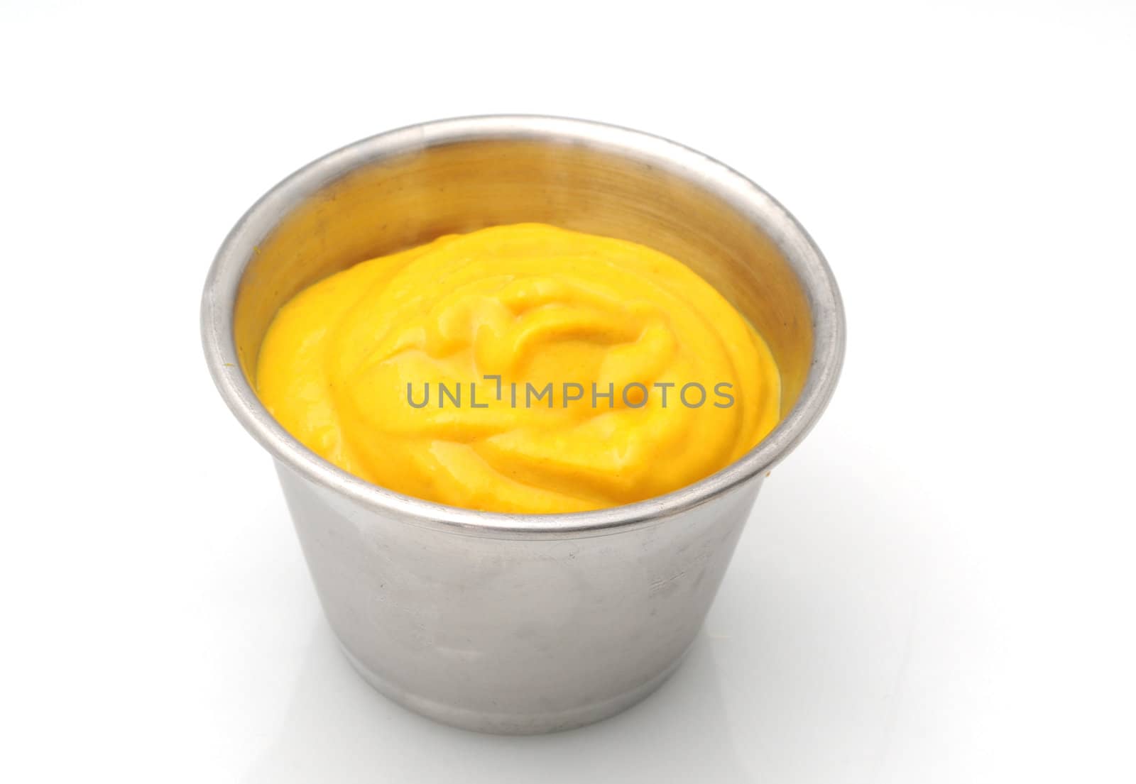 Yellow mustard condiment in a metal container