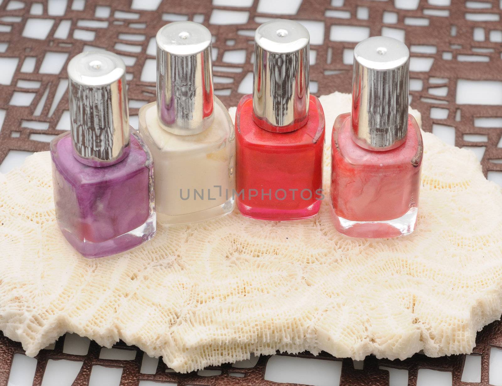 Four bottles of colorful nail polish by ftlaudgirl