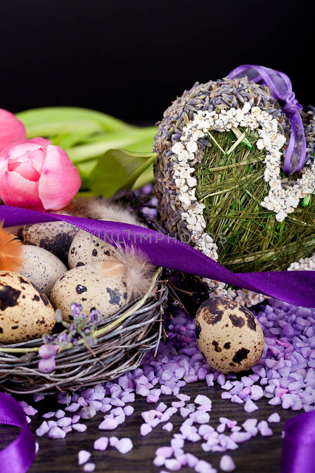pink tulips and brown eggs with purple ribbon colorful easter decoration