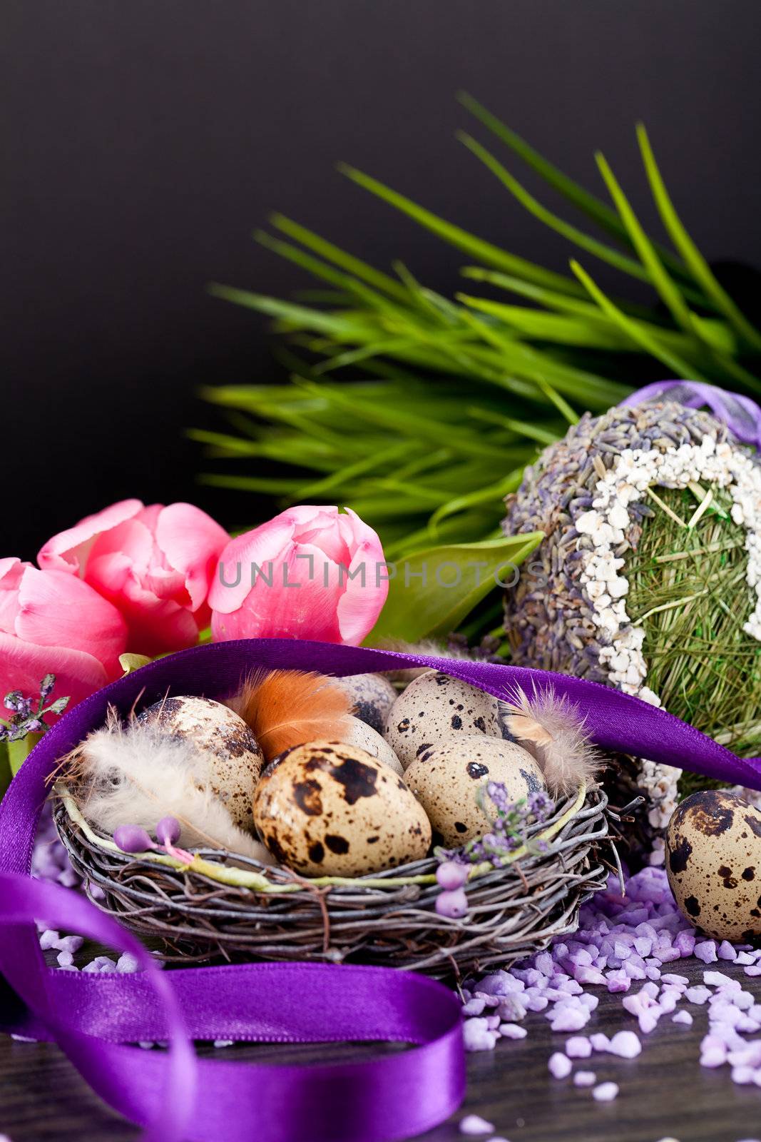 pink tulips and brown eggs with purple ribbon colorful easter decoration