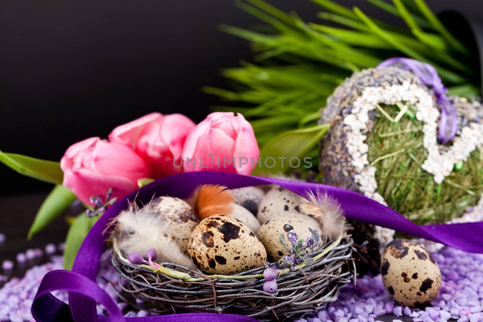 pink tulips and brown eggs with purple ribbon colorful easter decoration