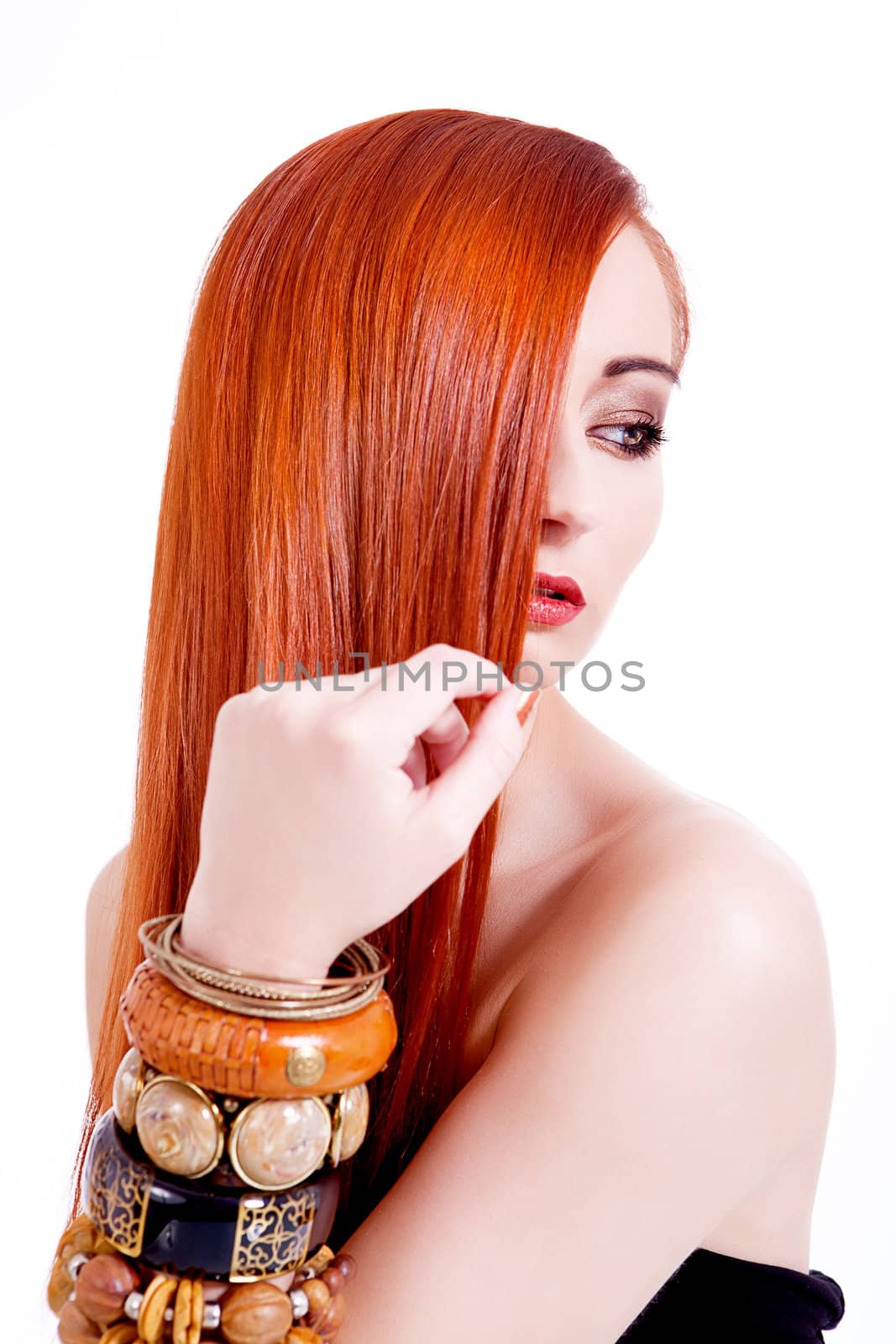 attractive young woman with shiny red hair and beauty makeup portrait