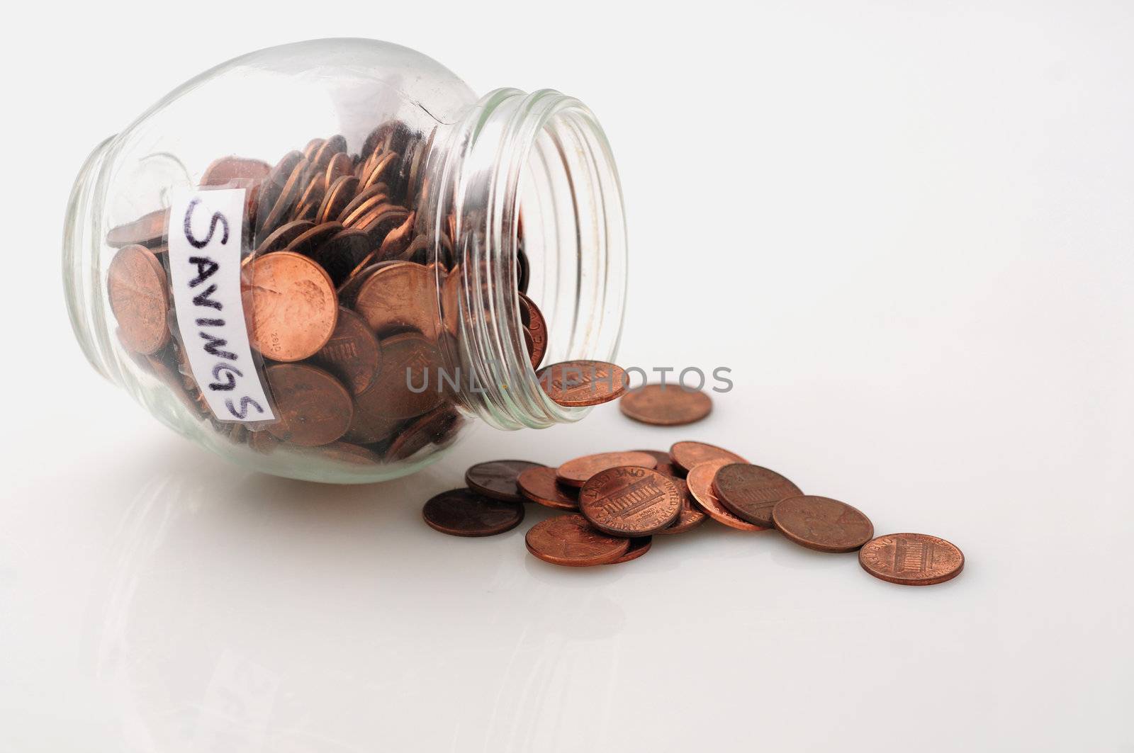 A concept image of jar with pennies to signify saving money or saving pennies