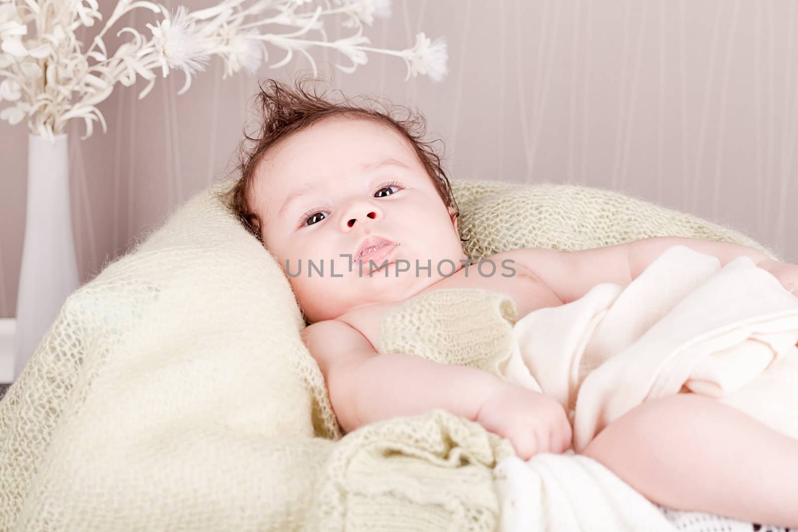sweet little baby infant toddler on white  blanket in basket at home