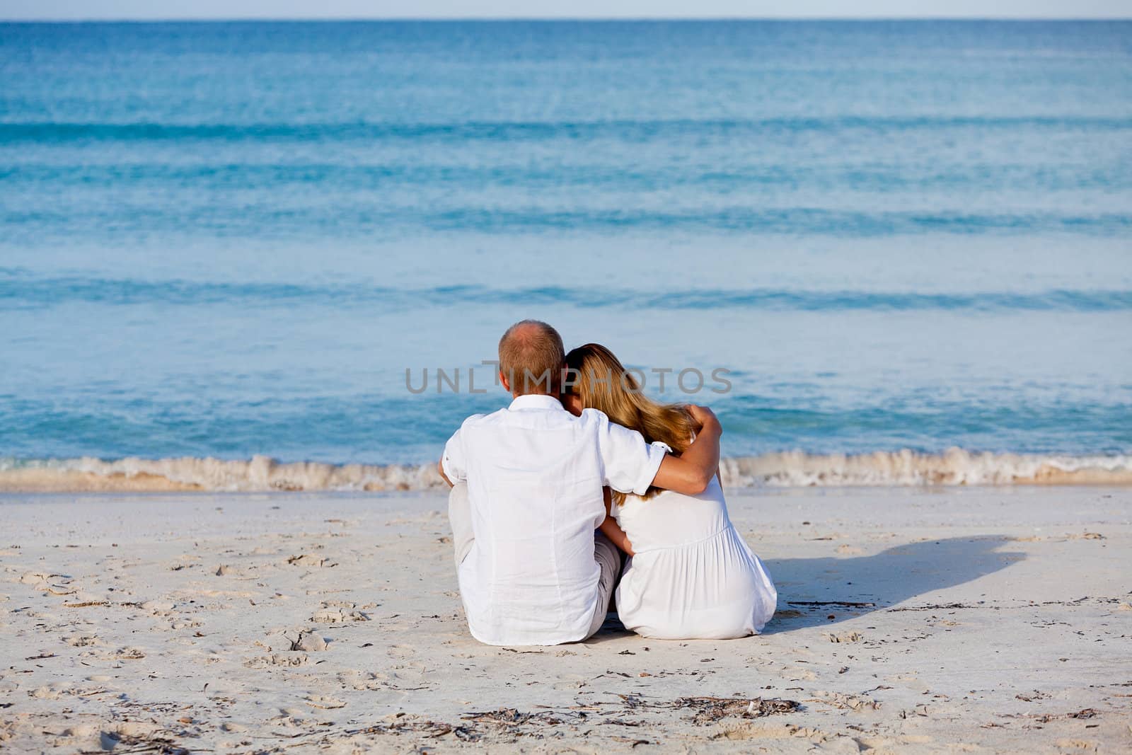 happy young couple in love having fun on the beach blue sky and sunshine 