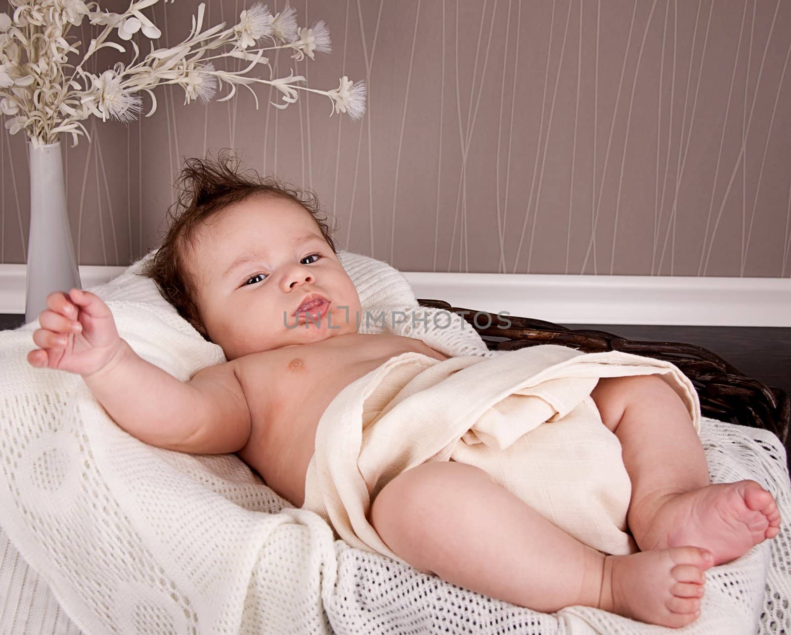 sweet little baby infant toddler on white  blanket in basket at home