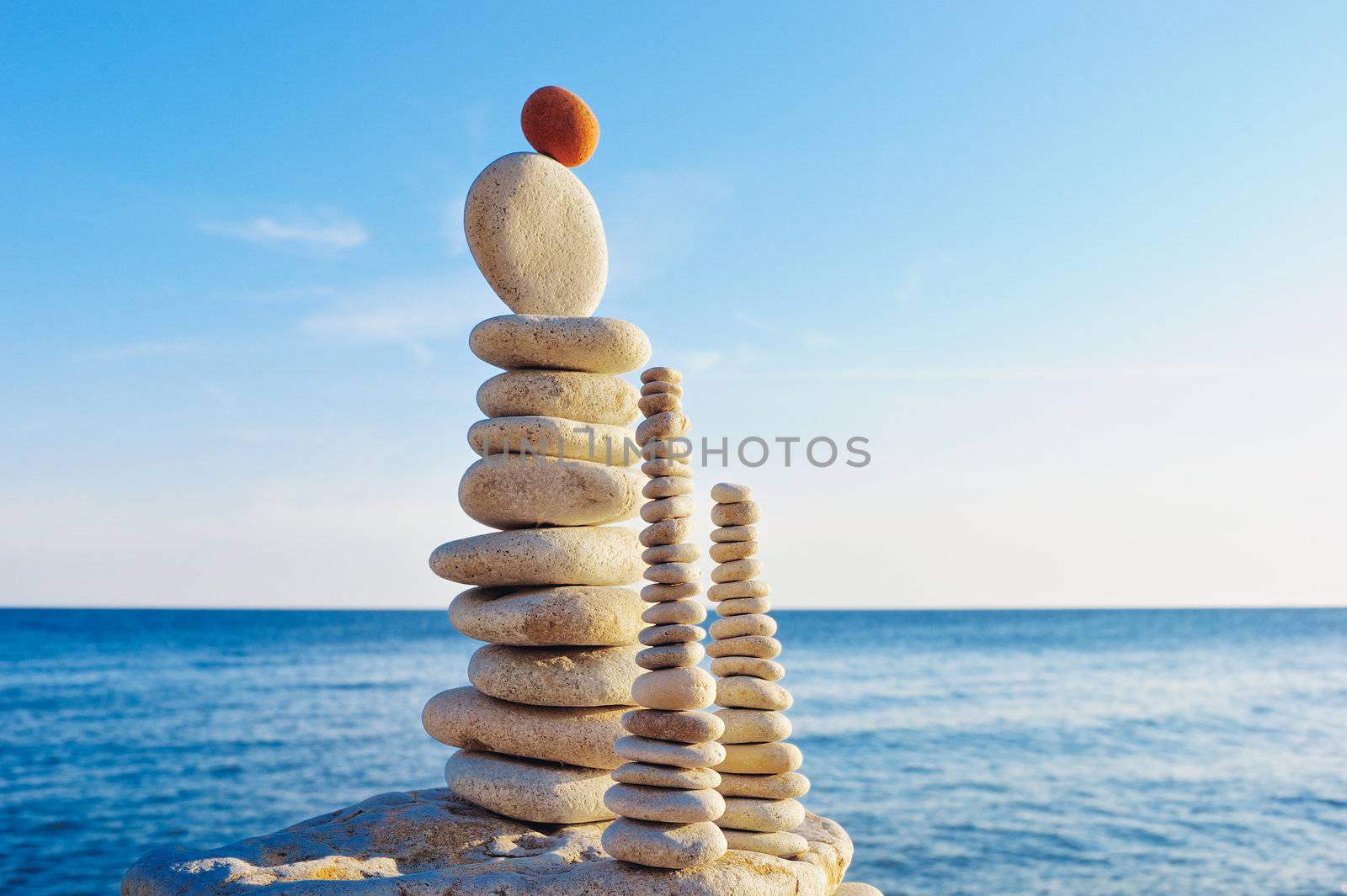 Stacks of pebbles in the balance on the seashore