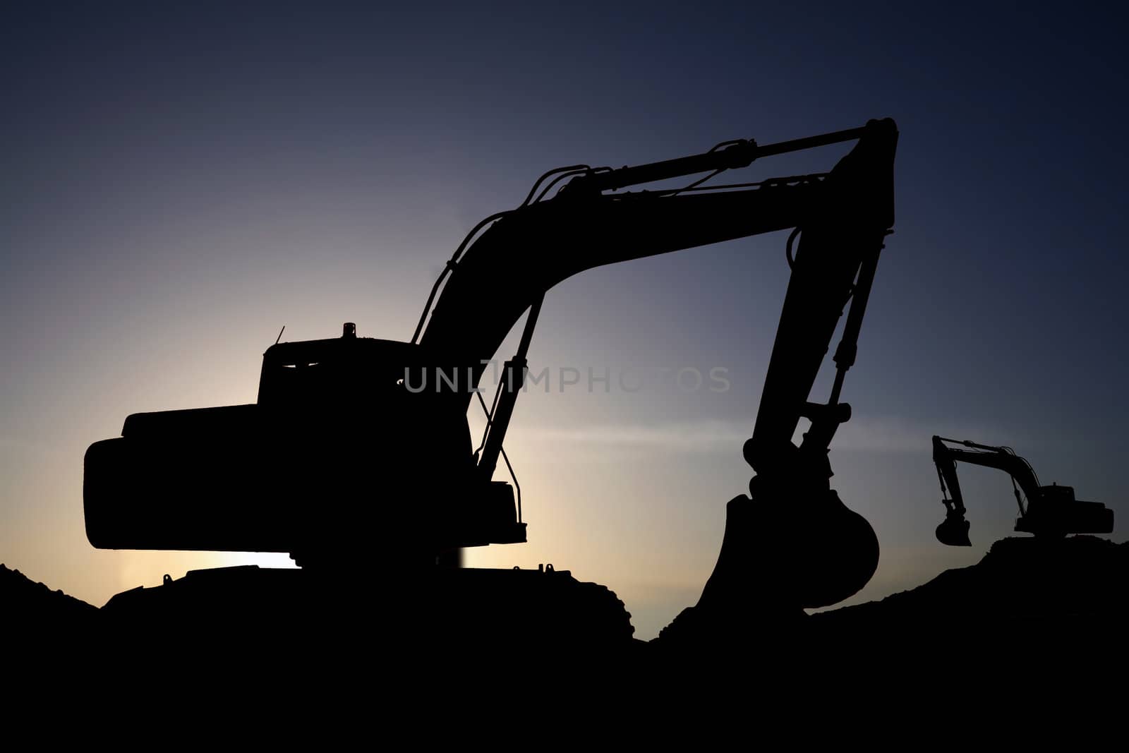 a bulldozer in a sunset
