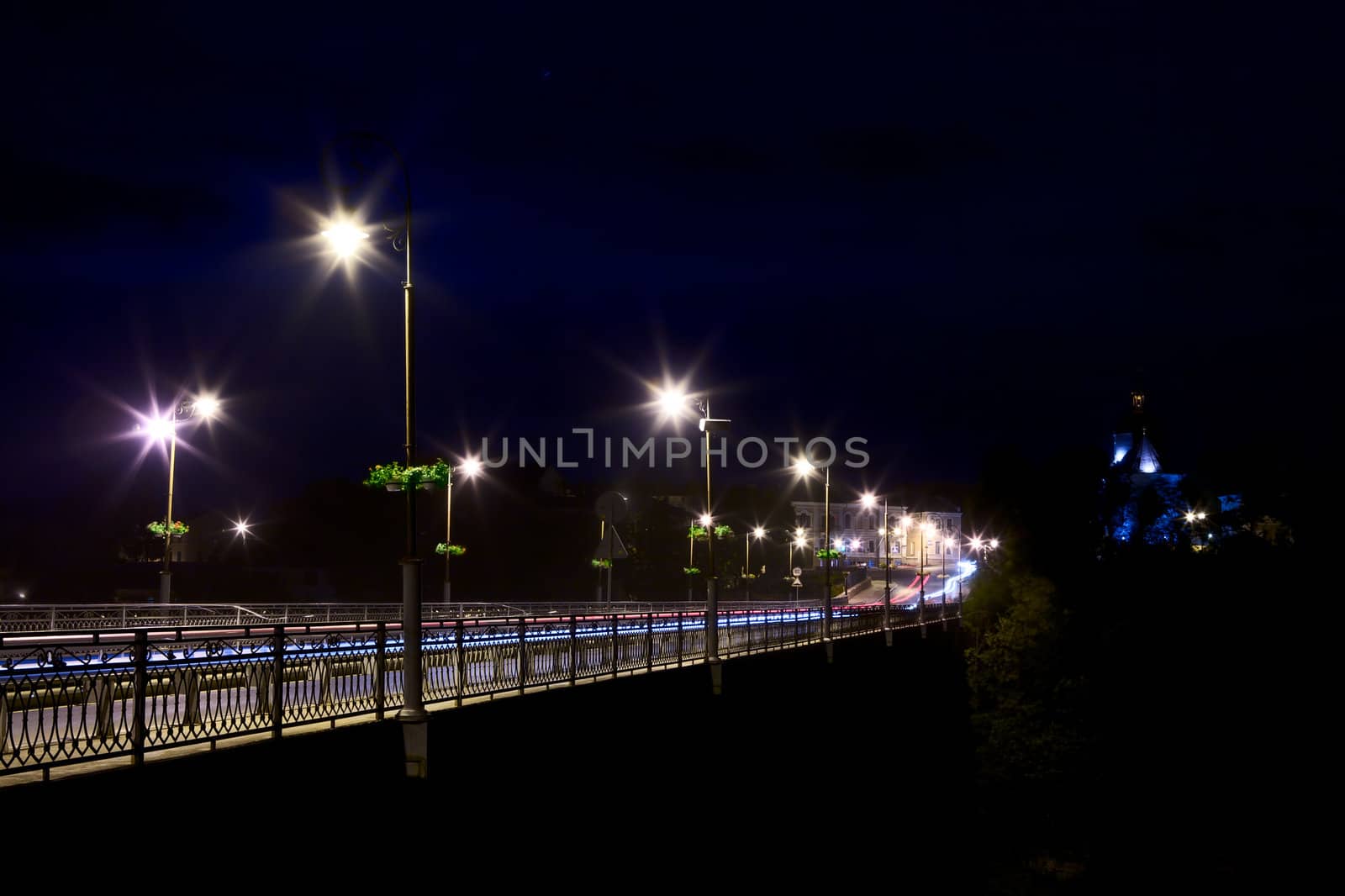 bridge over Smotrych River in Kamianets-Podilskyi, Ukraine, at night