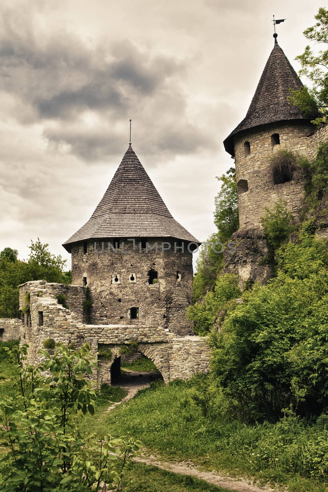 abandoned medieval castle at stormy summer day