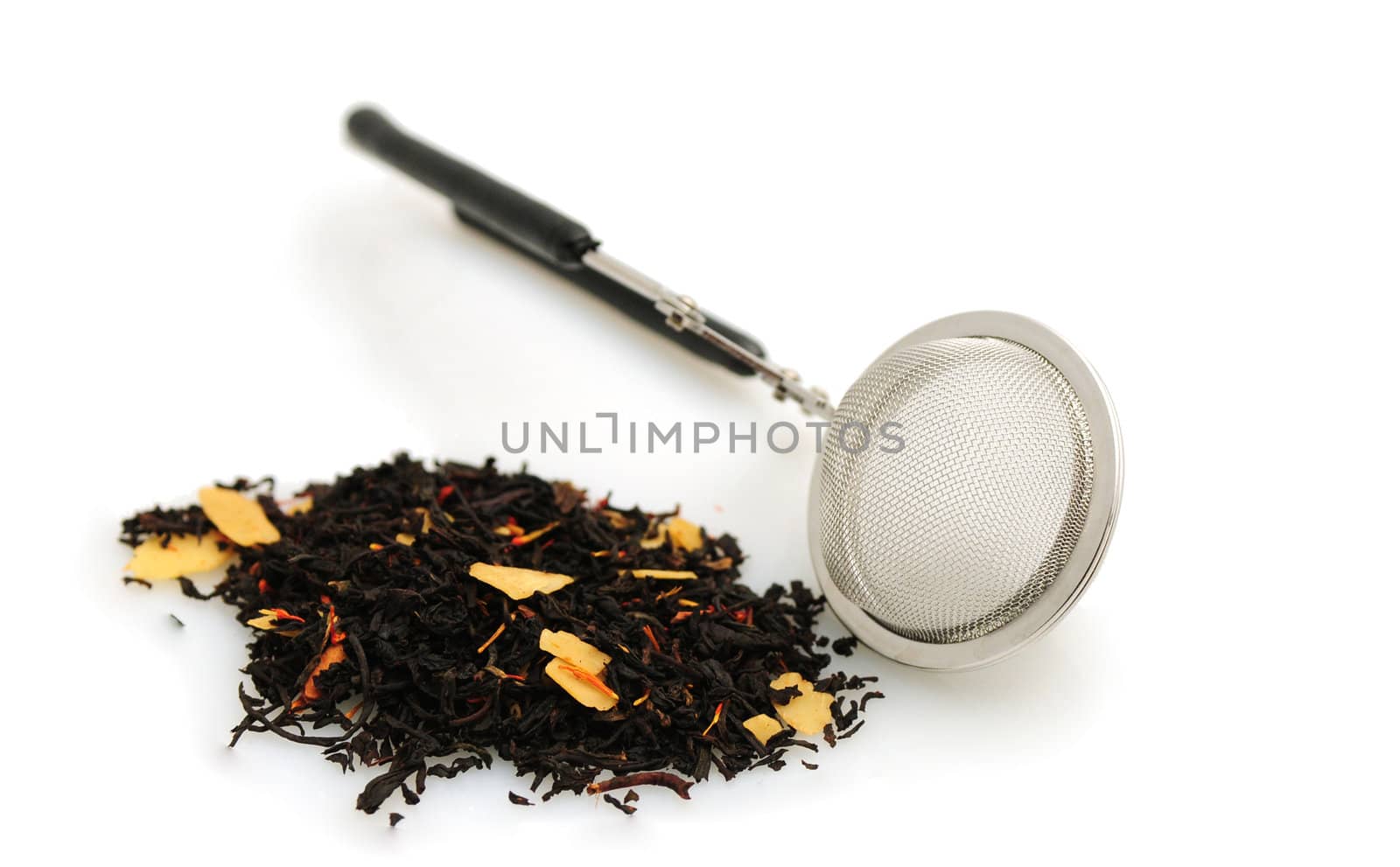 Black tea with tea infuser isolated on white background