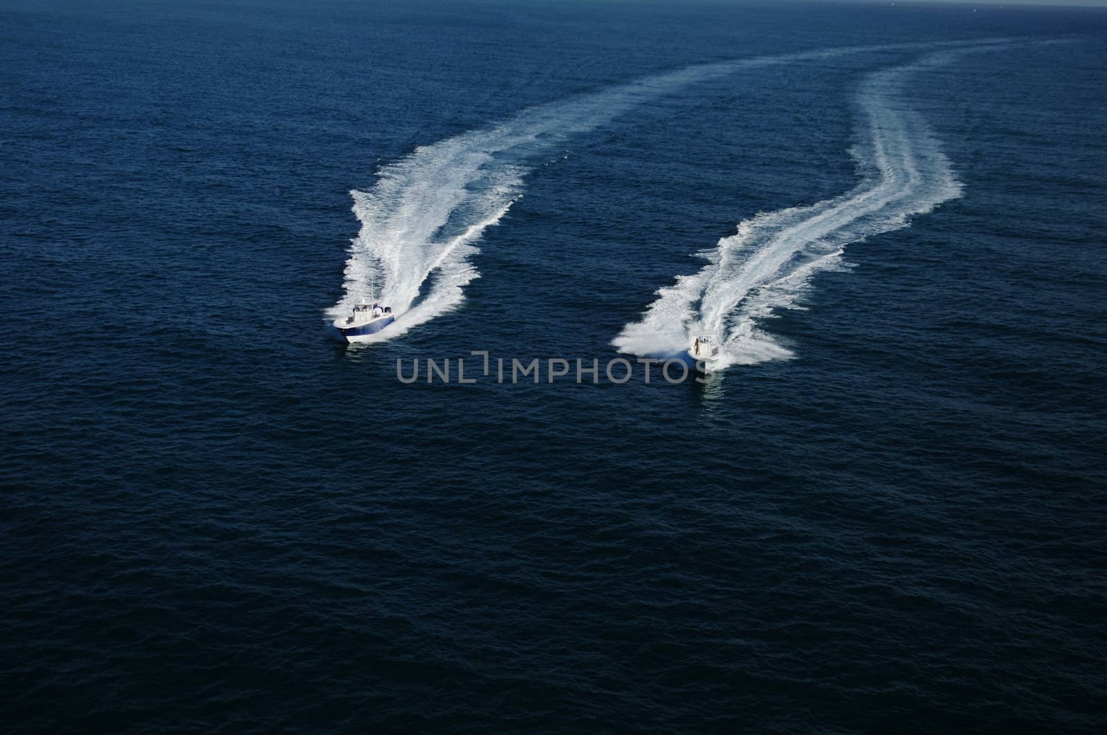 Two boats racing in Atlantic Ocean