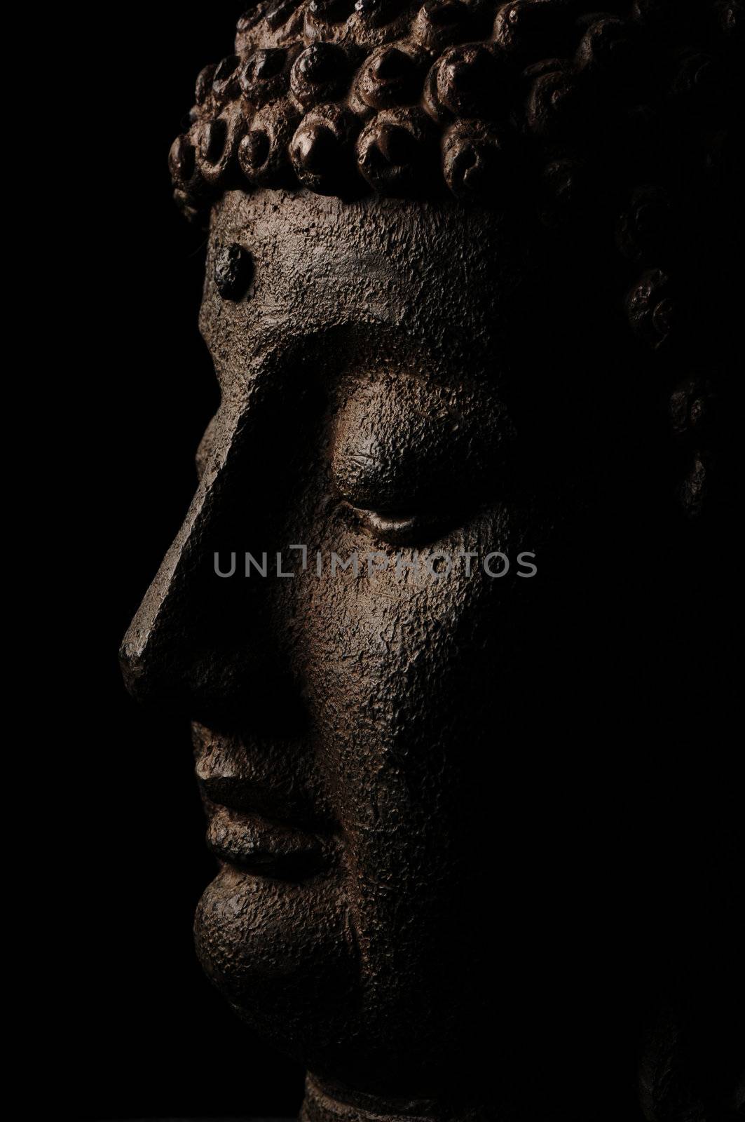 Buddha on black background in mediation