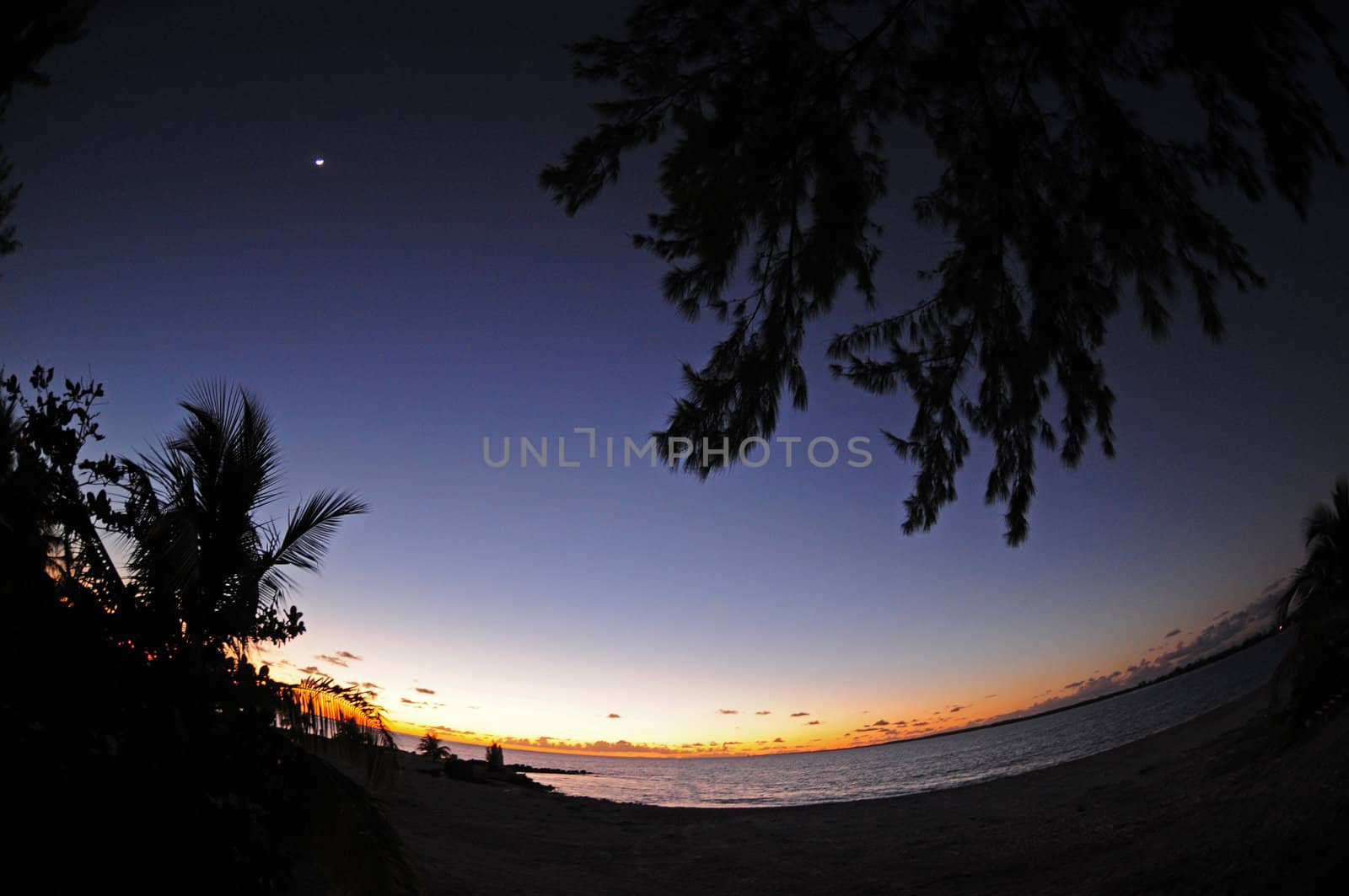 Tropical beach destination at night with fish eye lense