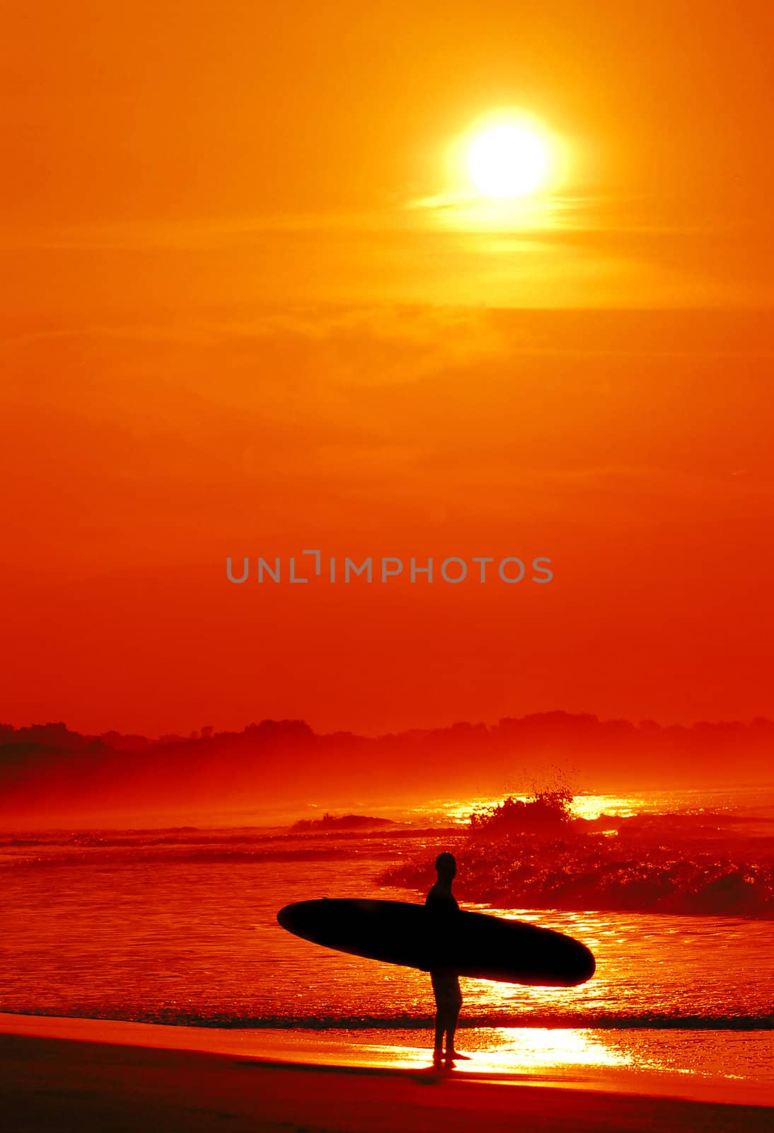 Surfer in tropical location with sunset by ftlaudgirl