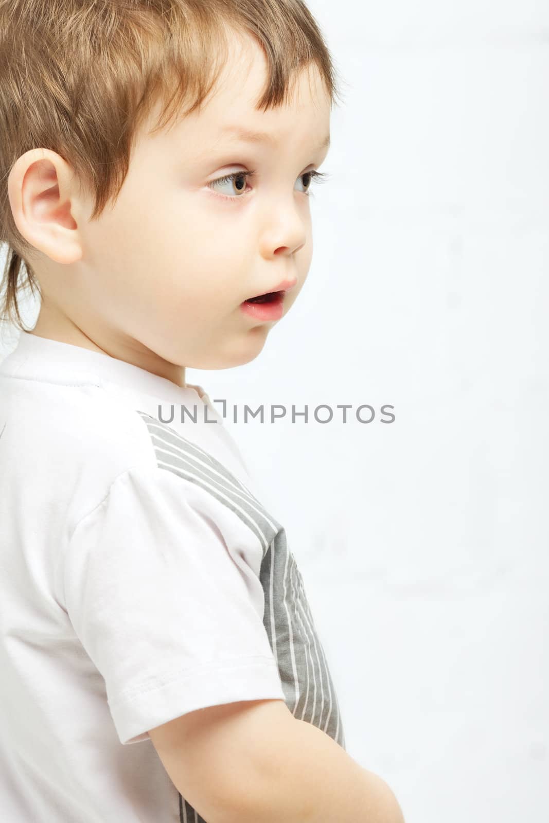beautiful serious boy with brown eyes portrait