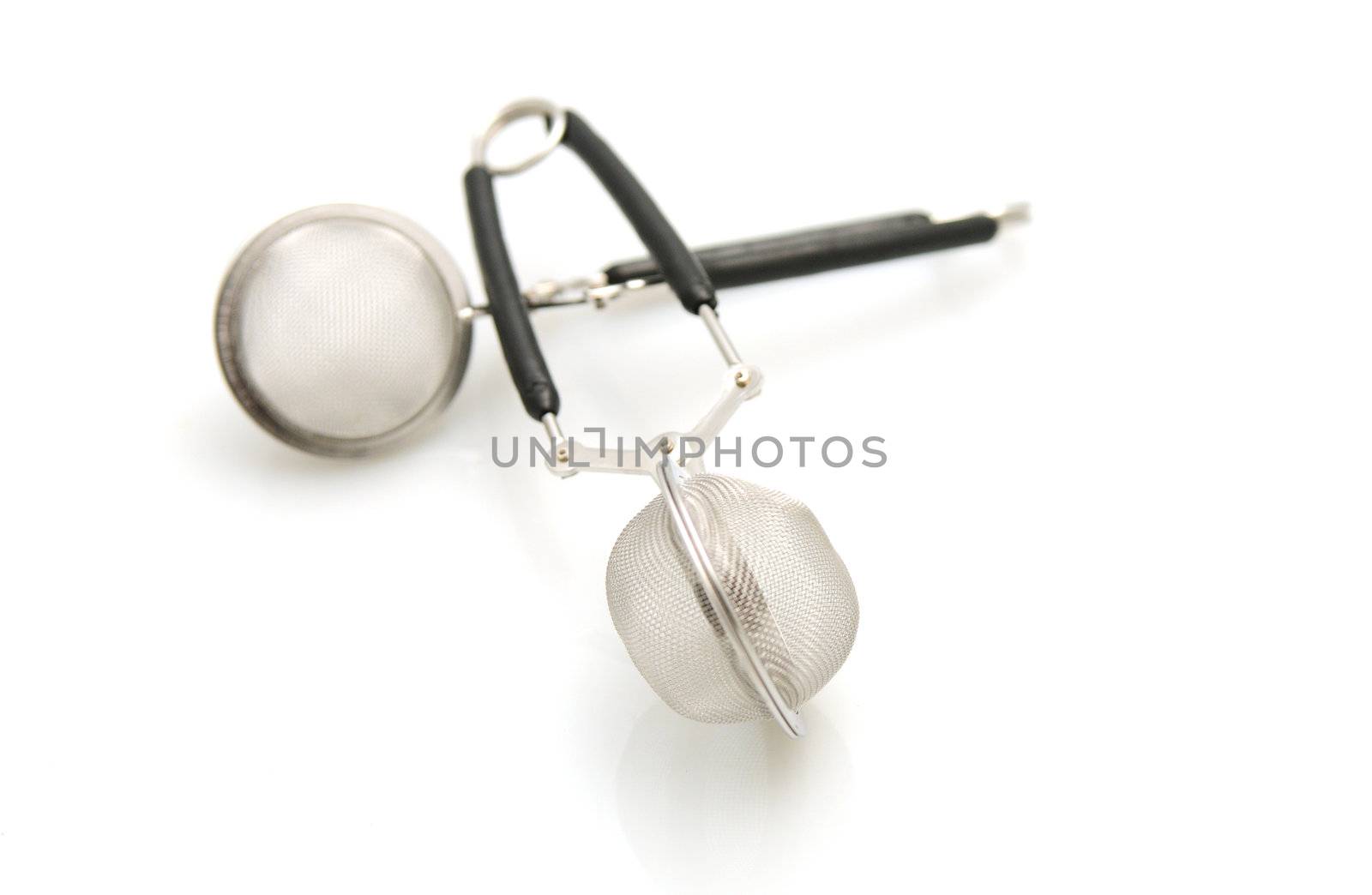 two tea infusers isolated on white background