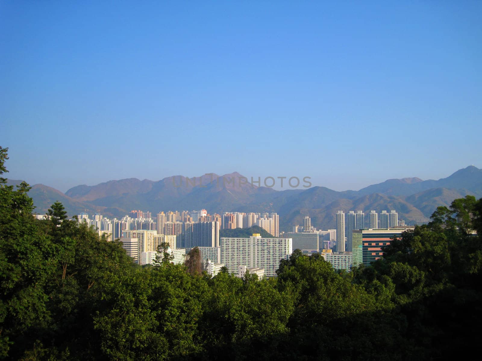View of Hong Kong with many buildings, skyscrapers and mountains