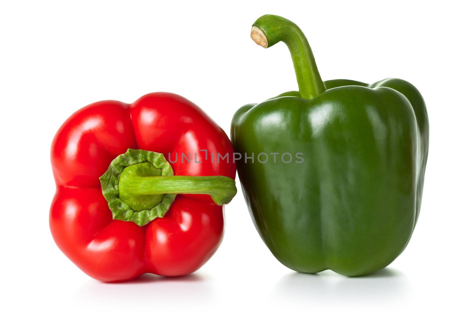 Fresh paprika (pepper) vegetables on white background. Red and green one
