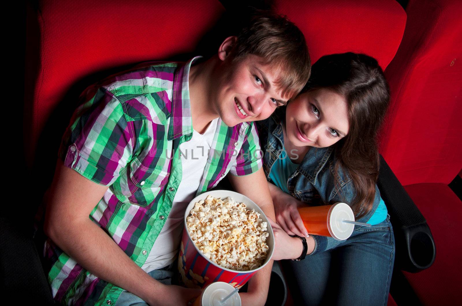 couple in a movie theater, watching a movie