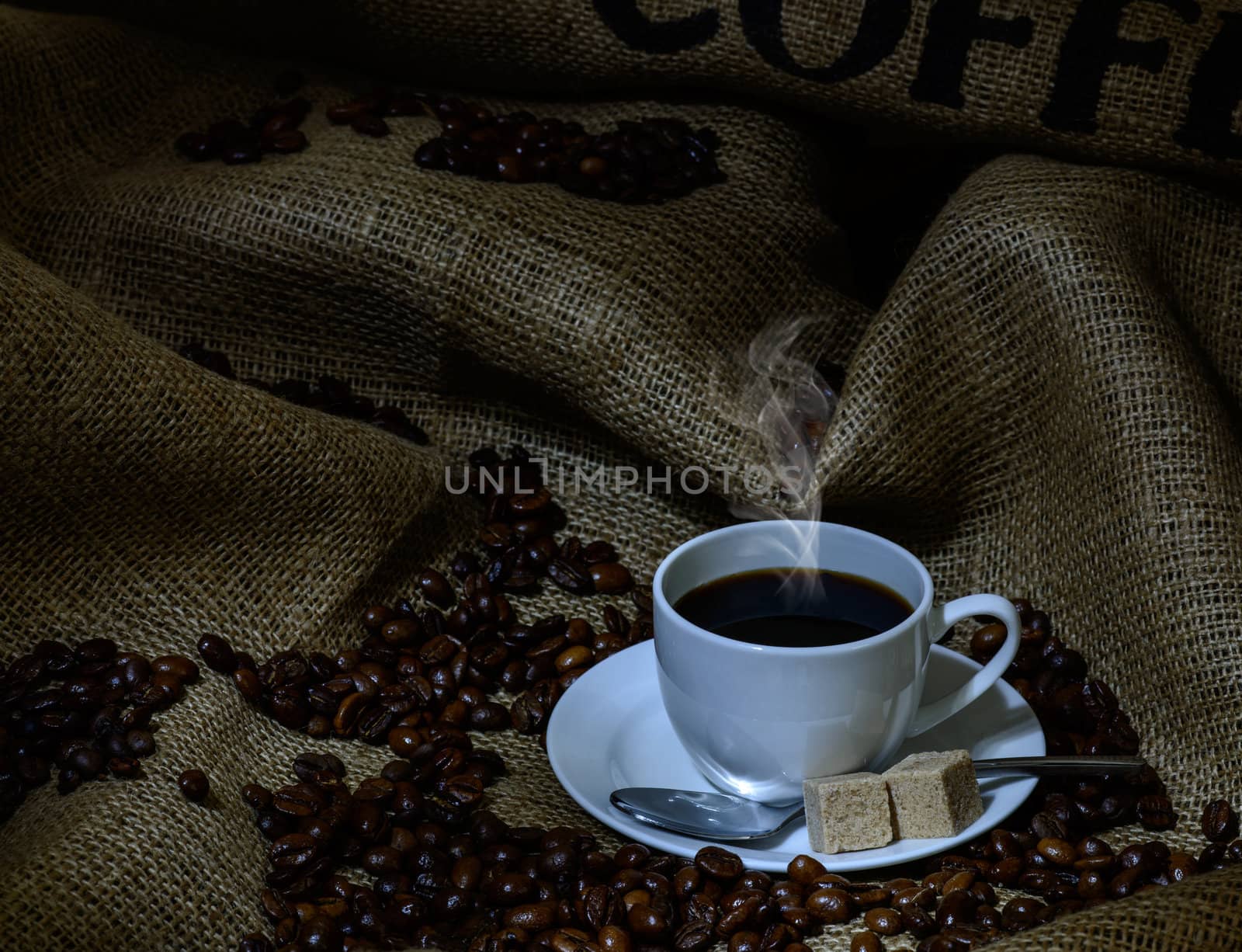 Coffee cup, beans and burlap. still life