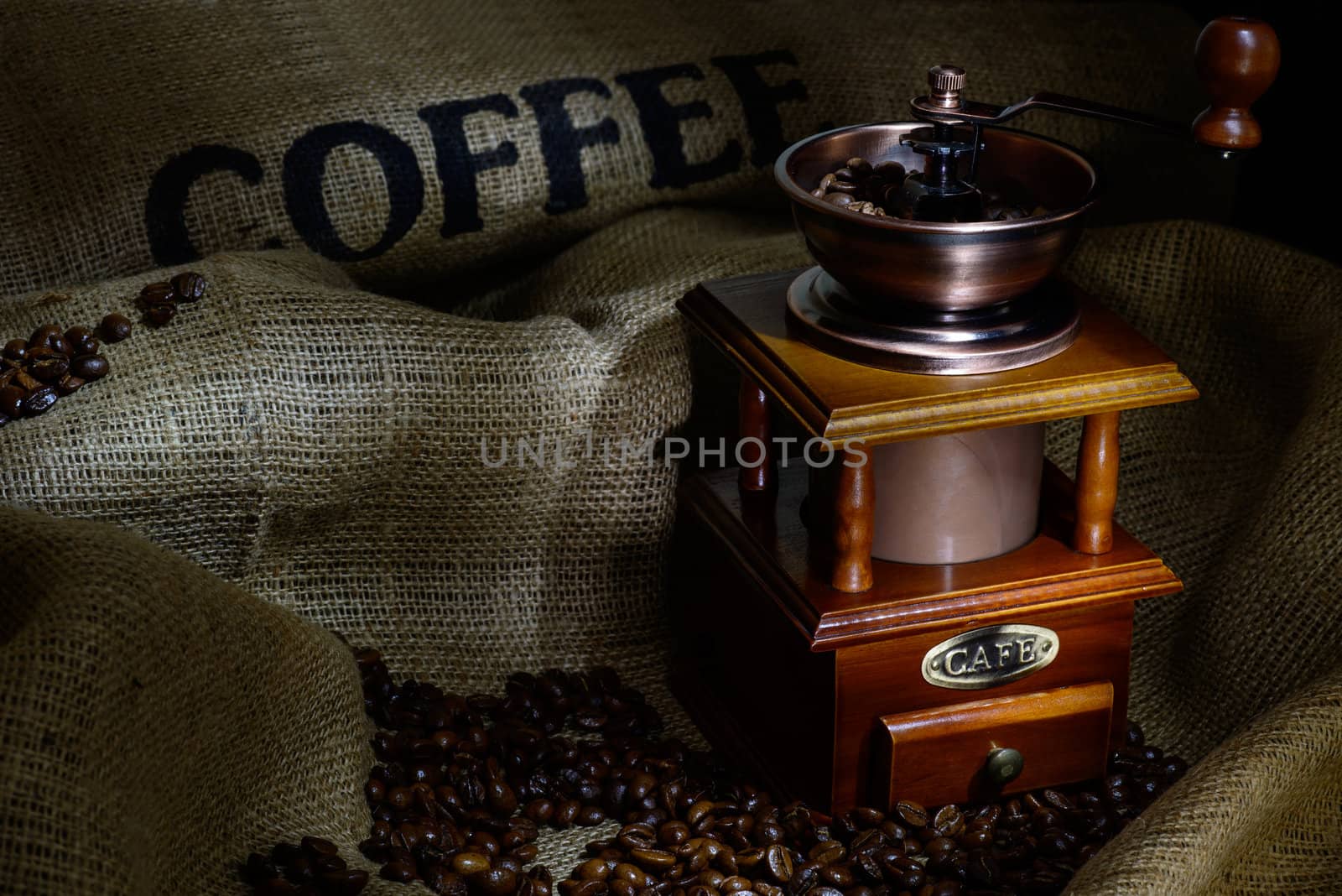 Coffee Mill with beans and burlap. still life