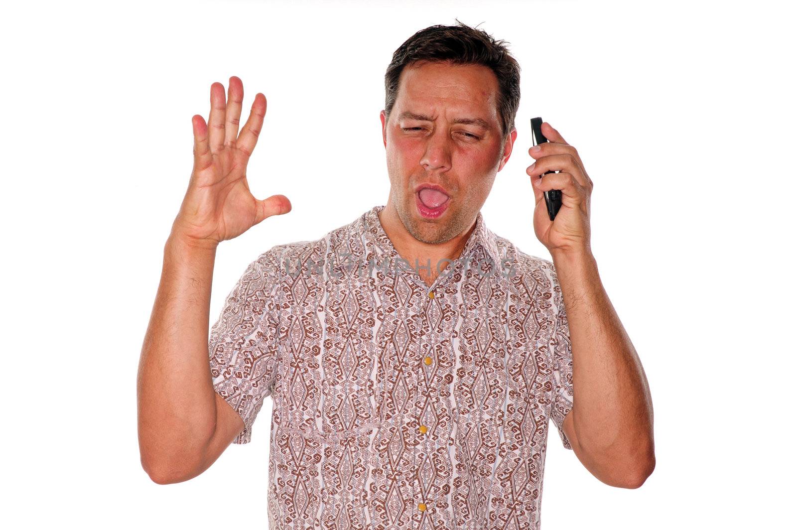 Angry young man yelling at phone in annoying phone conversation