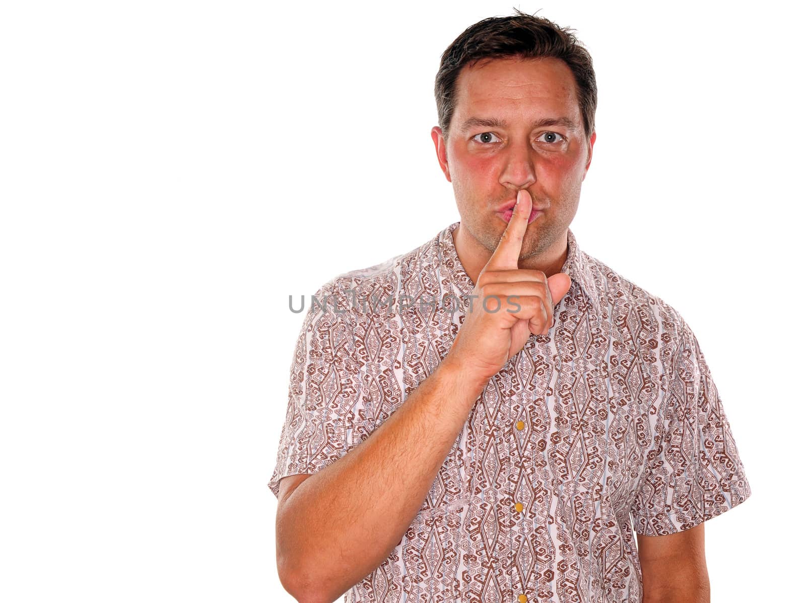 A young man gesturing to keep something confidential